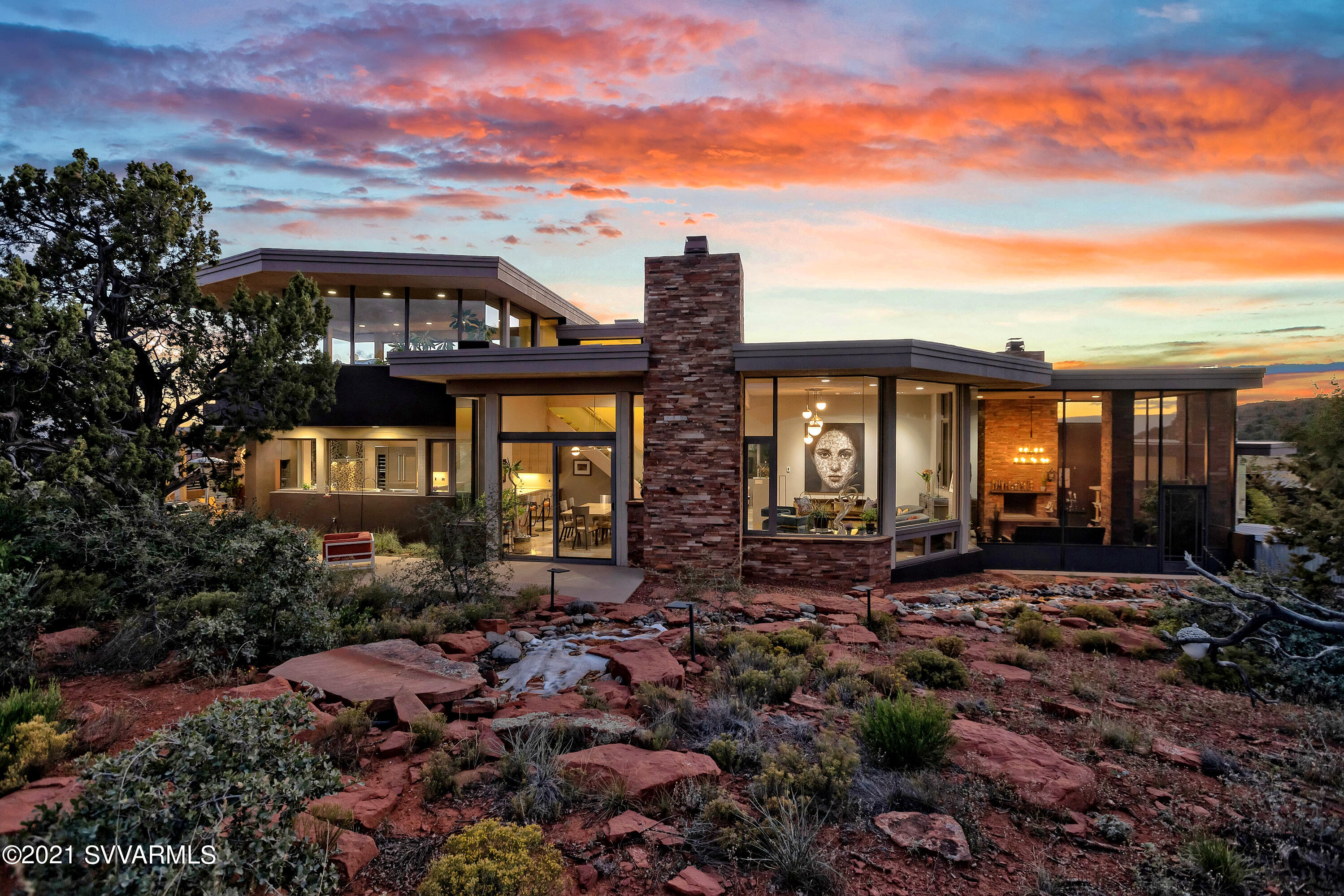 THE ABSOLUTE BEST BUY in Sedona Luxury Homes! Huge Price adjustment! Have it all right now for FAR less than the cost to build! Charles Van Block's Masterpiece of Contemporary Art & Architecture rises organically in a magnificent setting at Sedona's finest gated luxury home community surrounded by US Nat'l Forest & sweeping red rock panoramas. This work of art is a happy blend of sublime aesthetics & supreme comfort, cost saving technology, & luxurious appointments. Every room has a view, with 360 vistas in the ''Aerie Room.'' The common areas & primary bedroom suite feature in-floor radiant heat. Solar & geothermal systems cool & heat the home & run every thing else for $6.26 a day. The Chef's Kitchen boasts Thermador appliances. The perfect home for gracious living & serene relaxation. FIRST A REMINDER:

After reviewing the Amazing Amenities below, be sure to follow-up with the Matterport 3-D Self-Guided Tour.  There's a link in the PHOTOS Section.  It allows you to swoop down from the "sky" to any room in the house and wander through the place at you own pace.  It's been upgraded so that now you can even go outside to some of the patios and decks. It's quite a trip and gives you and really good sense of the flow of the residence.

THE AMAZING AMENITIES OF  35 ALTAIR AVENUE

This is truly a home with a marvelous blend of indoor and outdoor living with multiple viewing and entertainment patios and decks. The outdoors flows into the residence and the home reaches out to Nature.


GENERAL INFORMATION:
*  Gated Community  -  Sedona's Premier Luxury Subdivision Surrounded by US National Forest
*  Four Bedrooms (plus 5th potential); 4 & 1/2 Luxurious Baths 
*  Home borders Coconino National Forest
*  360 degree views from home's "Aerie Room" - Doe Mtn, Cockscomb, Thunder Mtn, Bell, Courthouse, Cathedral, Chimney Rocks, Airport Mesa, Lights of Sedona and Jerome, and more...
*  Red Rock Views from every room.
*  Multiple Outdoor Entertaining Areas
*  Large Screened Porch (not included in the square footage)
*  Entry Art Gallery
*  Media Room
*  Elevator
*  Dual Laundry (Primary Suite & 1st Guest Room)
*  3 Gas (propane) Fireplaces: Living Room, Master, & Screened 
    Porch
*  Large Exercise Room & bath (potential 5th Bedroom)

ENERGY EFFICIENCY
* All Electric/Solar Powered Electricity: Heat, A/C, Water Heater, & All Kitchen Appliances
*  Super Energy Efficient Home (avg energy bill: $6.26 per day in 2022)
*  Geothermal
*  Owned Solar System - Ground-based Sun-Tracking (2016) provides electricity to power home
*  Exterior Walls: 8" thick Flexcrete Block + R19 Insulation + wood stud creating 14"
*  Low-E Windows
*  Radiant Heat in all Common Areas and Primary Bedroom Suite Floors
*  Dual Mechanical Rooms

CONSTRUCTION
*  Western Windows & Doors
*  Security Screens
*  Travertine Floors
*  Wood Ceilings
*  Custom Cabinetry
*  Custom Solid Doors Throughout
*  Custom Stainless Steel Entry Door
*  Harvested Dead Standing Douglas Fir Beams from Colorado
*  Trex Decking
*  Built-up Elastomeric Roof - Re-coated 2021
*  Exterior Painted in 2021

ADDITIONAL FEATURES
*  Whole House Central Vacuum
*  Wine Cellar Room - ready to be built out
*  Steam Shower in Primary Suite Bath
*  Rainfall Shower Heads Throughout
*  Thermador  Kitchen
*  Wine Refrigerator
*  Hot Tub off Master Bedroom Conveys with Sale
*  Oversized Multi-Car Garage
*  90 foot long water Feature
*  Whole House Water Purification System
*  10 Patios and decks of various sizes to maximize Outdoor Living

MANY OF THE FURNISHINGS ARE AVAILABLE FOR PURCHASE OUTSIDE OF ESCROW.

See Matterport Floor Plan in DOCUMENTS

6282 sq. ft. is based on Matterport measurements which generally underestimate the home size.