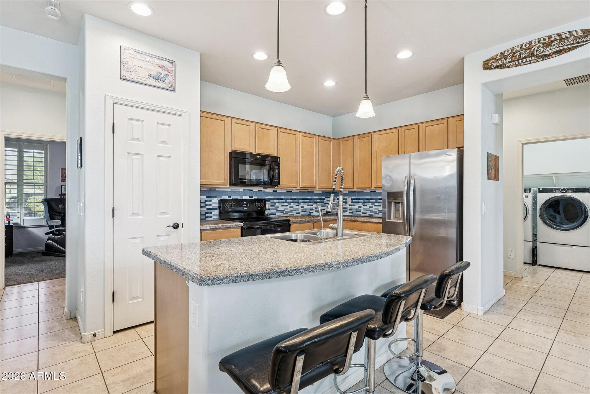 A true turn key home - just steps from the clubhouse and lake in this gated adult community! This light-filled home features an open split floor plan, a granite kitchen with a large island, and an oversized secondary bedroom perfect for an office or hobby space. Enjoy your morning coffee on the charming front porch, then relax out back with ravine views, mature greenery, and a private putting green. Love to travel? The fully enclosed patio with powered, weatherproof screens lets you lock up and go with total peace of mind - comfort and convenience all year long! The icing on top? The incredible neighbors the sellers are sad to leave behind.