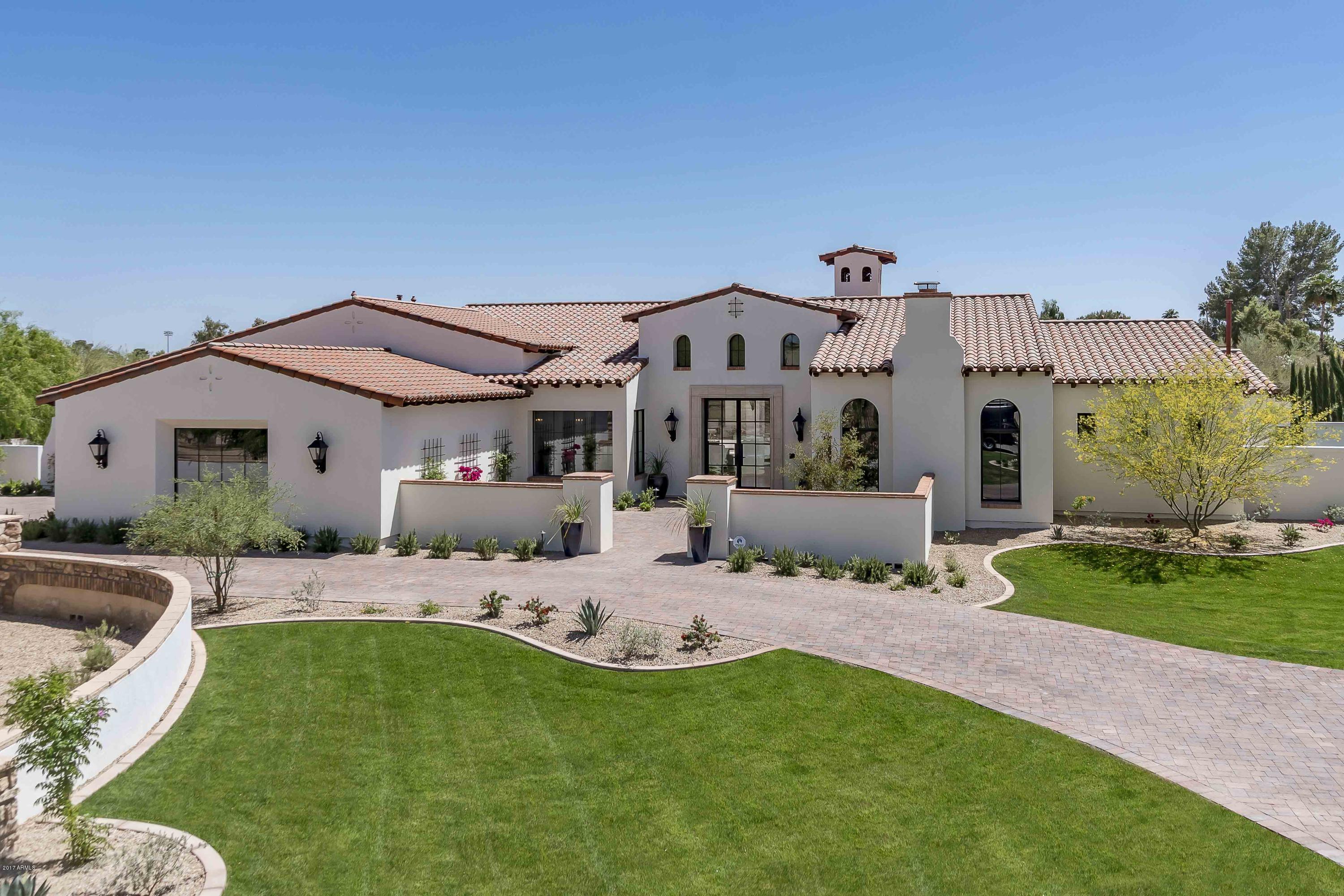 NEW QUALITY SPEC HOME, REDUCED $400,000 COMPLETED IN DECEMBER OF 2016 (IGNORE DAYS ON MARKET). Renowned Builder GEOFF EDMUNDS, 40+ years of experience building HIGH-END LUXURY PROPERTIES. A 26' wide bi-fold steel cased wall of glass doors frame fabulous views of Camelback Mountain. Designer selected exotic materials which include: Crema Vosscione Limestone, DuChateau French Oak flooring, and Serpeggiante polished stone. Soap stone & Imperial Danby marble grace this true connoisseur's kitchen. Clean lines of a transitional architectural style strike the perfect balance between TODAY & TIMELESS. Split floor plan with proportionally precise rooms & ceiling heights hit all of today's modern living requirements & expectations. 1,000 SQFT Guest House creates a backyard enclave mirroring back... to the main house across the beautifully designed pool with numerous water features. Amazing location close to schools, multiple signature resorts, shopping, and heart of "in-town" activities. Immediate gratification on all levels! Interior furniture is available by separate bill of sale.