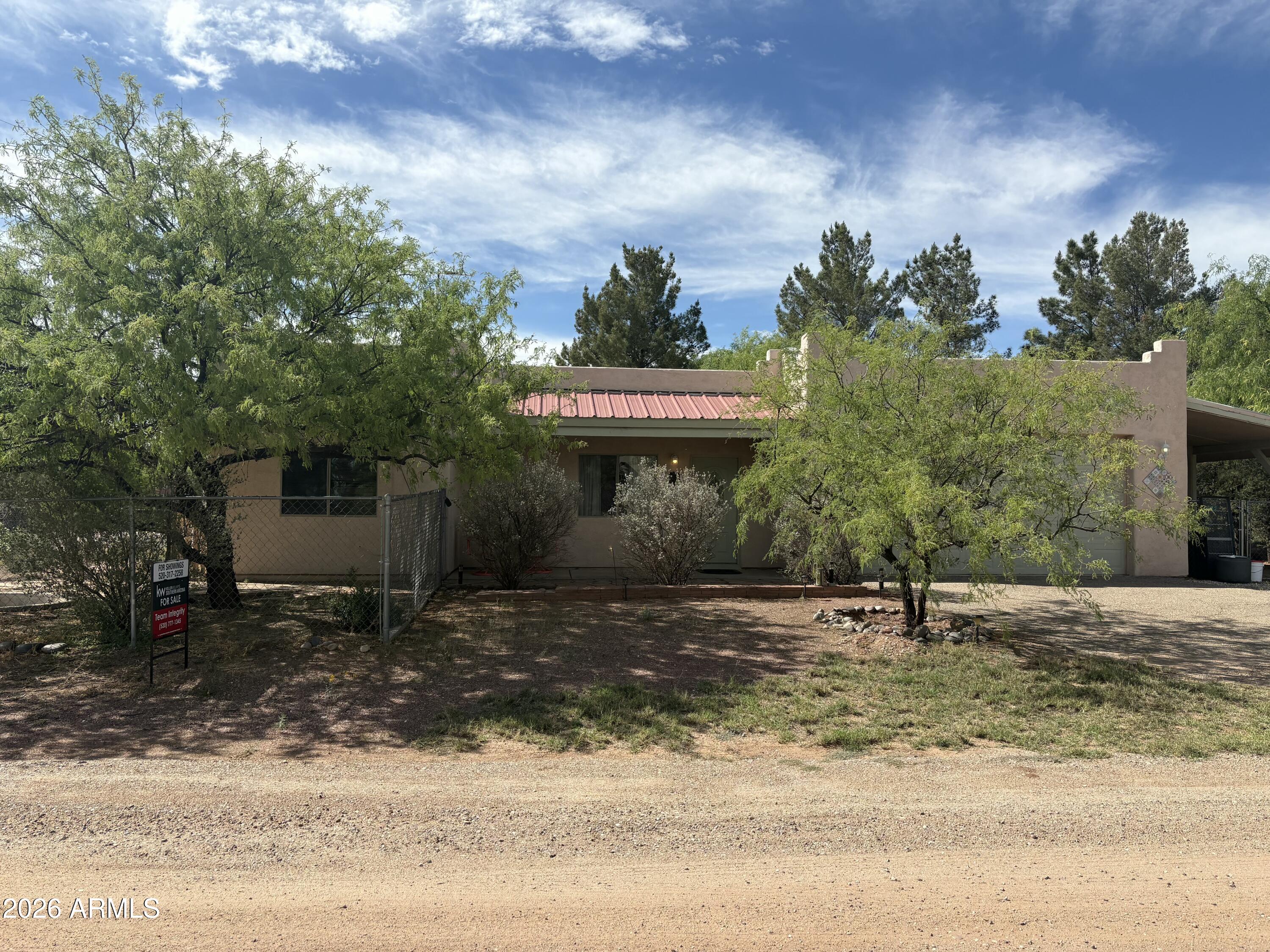 This 3-bedroom, 2-bath site-built home in Benson offers comfort, convenience, and an ideal location just off I-10. Perfectly situated for commuters, it provides easy access to Tucson, Benson, and Sierra Vista. RV parking and oversized garage gives you space for toys and projects. The house is situated between two mountain ranges, minutes away from the Rincon mountain wildernessInside. You'll find a functional floor plan with a spacious living area, a well-designed kitchen with ample cabinet space, and a comfortable dining area. The primary bedroom features a private bath, while two additional bedrooms provide flexibility for guests, family, or a home office. Enjoy the peaceful surroundings and beautiful desert skies that Benson is known for.