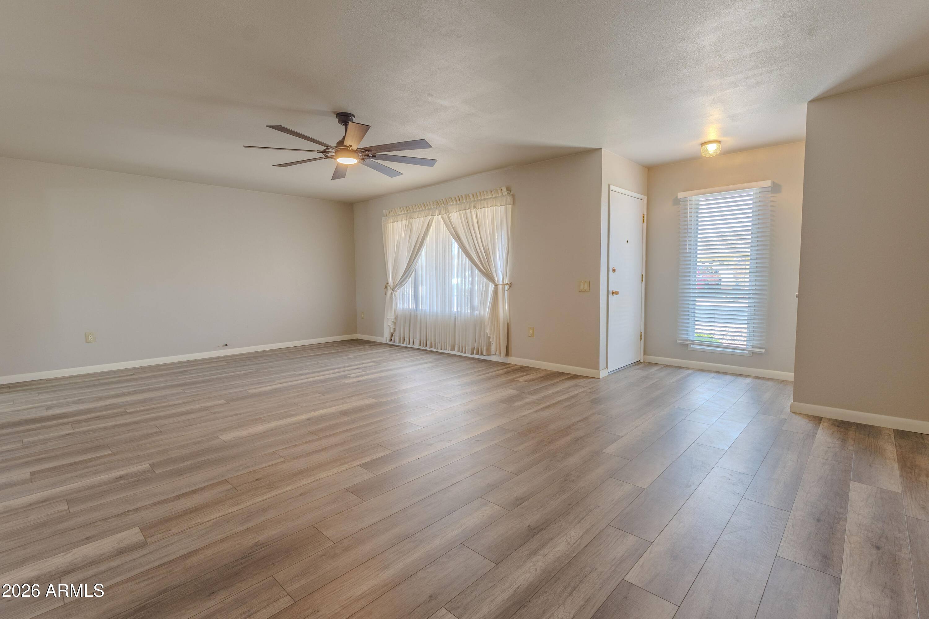 Welcome to this well-kept home in the heart of Sun City! This 2 bed, 2 bath home also has a great flex space that works perfectly as an office, hobby room, or even an extra guest area.
You can really tell this home has been taken care of. It's had some nice updates throughout, giving it a clean, comfortable feel while still keeping that classic Sun City charm. The layout is open and easy to live in, with plenty of natural light coming in.
The backyard is a great mix of low-maintenance desert landscaping and mature trees, so you get both shade and that Arizona vibe--perfect for relaxing or having people over.
Located in a great part of Sun City, you're close to golf, rec centers, shopping, and everything the community has to offer.
Move-in ready and easy to love--come take a look!