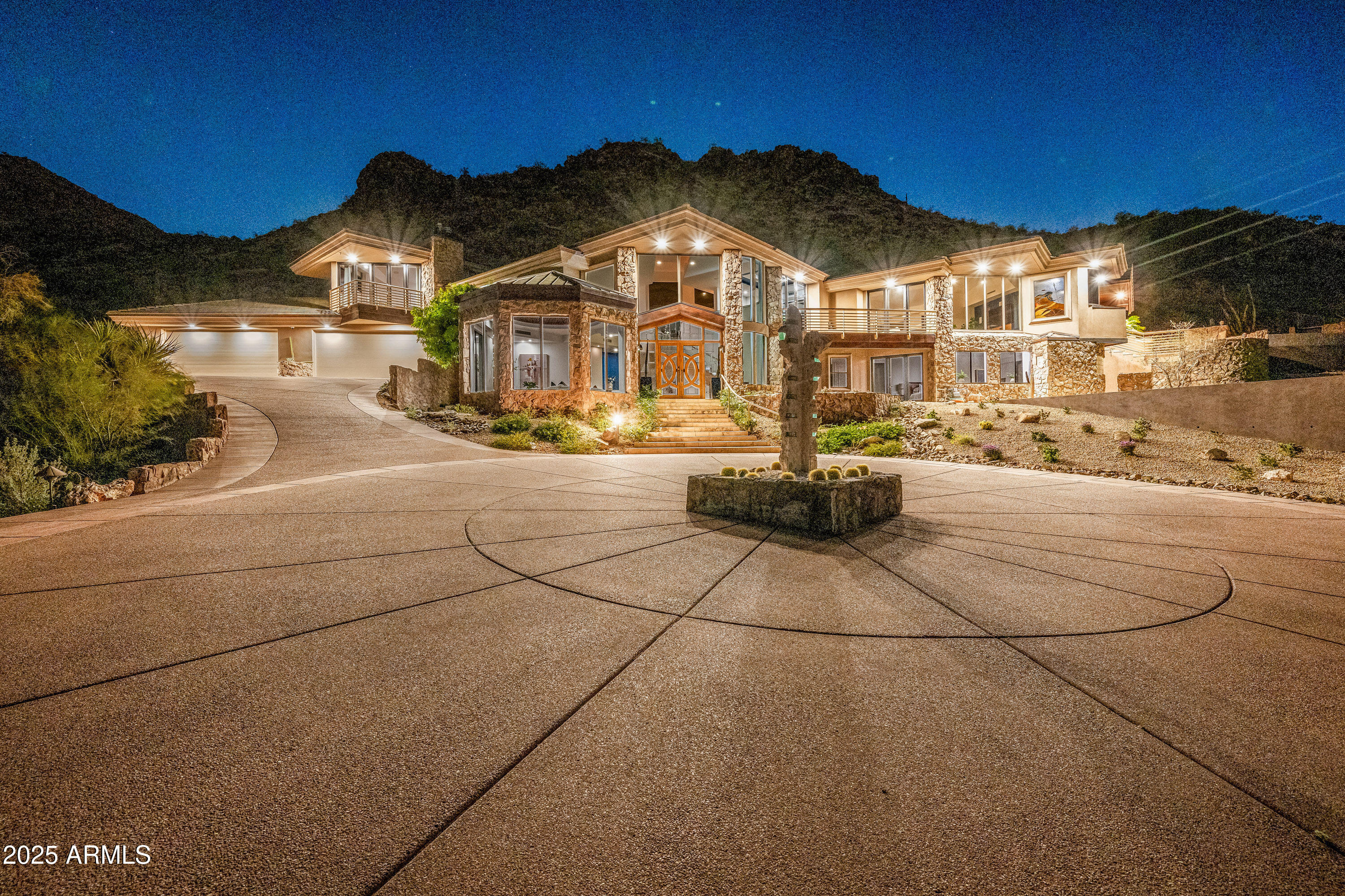 This private-gated hillside estate, with sweeping 180 degree panoramic views from Mummy Mountain, is an opportunity to own a premier property on 5+ acres with unparalleled privacy and seclusion on one of the most desirable streets in Paradise Valley. Offering 7,750 SqFt of living space and the potential for major expansion, this home provides unmatched flexibility for the discerning buyer. Entertain seamlessly from indoor to outdoor between the oversized chef's kitchen, indoor and outdoor bars, two outdoor BBQ areas, a heated infinity-edge pool and spa with water feature, gas fireplaces, expansive covered patios, and incredible VIEWS from EVERY ROOM!