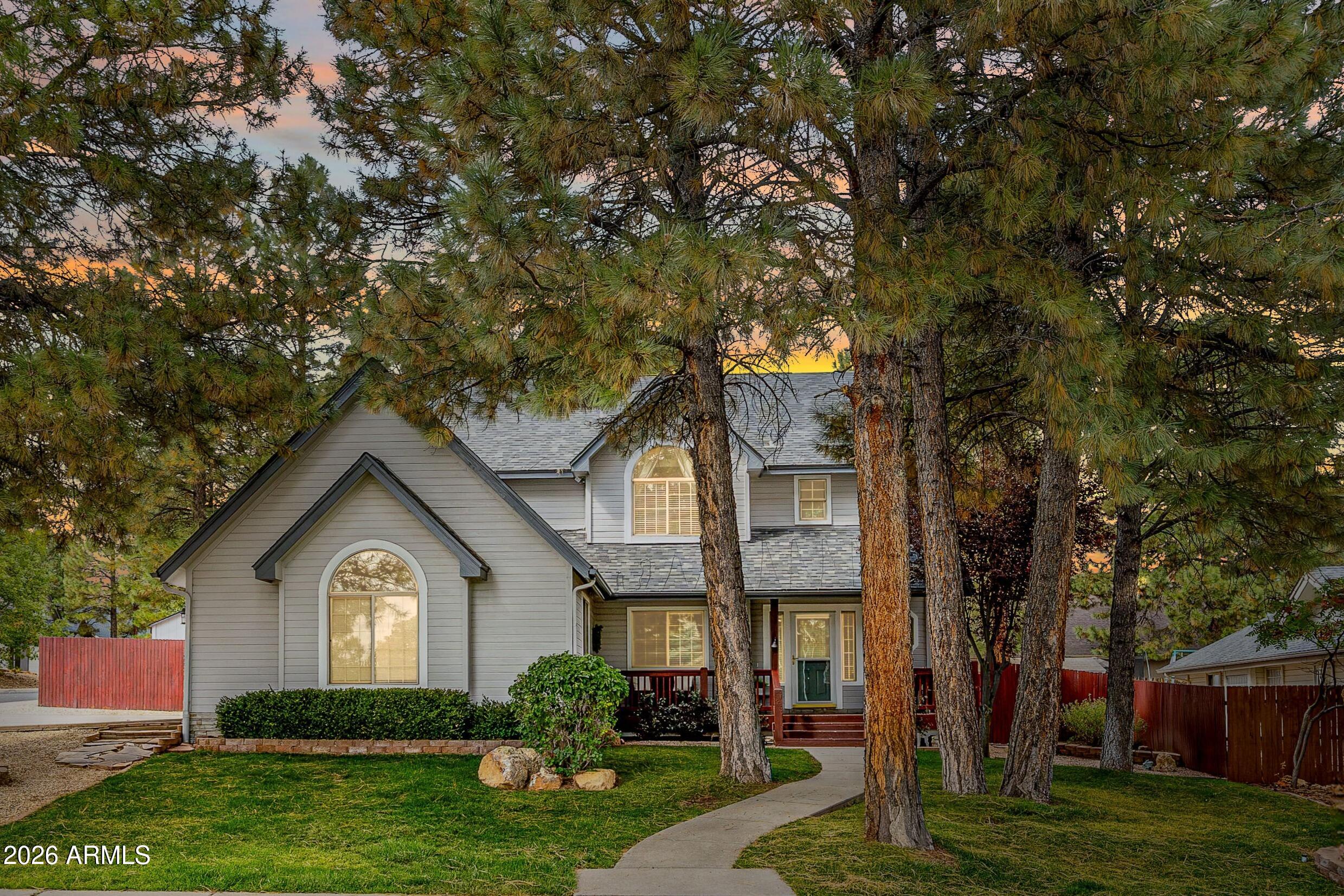 This stunning custom 5-bedroom, 4 bath home in Flagstaff is tucked away on a quiet cul-de-sac in the desirable Walnut Ridge neighborhood. Offering more than 3500 square feet of refined living, it features three inviting living spaces, including a spacious great room, theater/game room, and upstairs family room. The well-appointed kitchen includes a breakfast bar, abundant cabinetry, and generous counter space. A main-level bedroom with full bath adds flexibility, while the primary suite showcases a beautiful en-suite bath, dual walk-in closets, and an attached bonus room ideal for an office or study. Enjoy the 3D virtual tour & the fully fenced backyard with lawn, covered patio and open deck, plus an oversized 3-car garage with excellent storage. Close to trails, forest and freeway access.