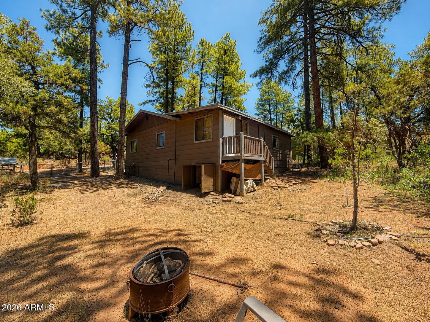 Tucked among the towering pines in the highly desirable Strawberry/Pine area, this charming mountain retreat offers the perfect escape. Featuring 2 bedrooms plus a versatile bonus room ideal as a 3rd bedroom, office, or den, and 1.5 bathrooms, this cozy cabin blends comfort and mountain charm. Enjoy a warm interior with a wood-burning stove, a  front deck perfect for morning coffee, and peaceful surroundings where elk are frequent visitors. The fully fenced yard features mature  trees, a fire pit, and plenty of space for entertaining, pets, and outdoor enjoyment. With no HOA, RV access, and close proximity to lakes, hiking trails, and endless outdoor recreation, this is your chance to experience the best of Arizona mountain living.