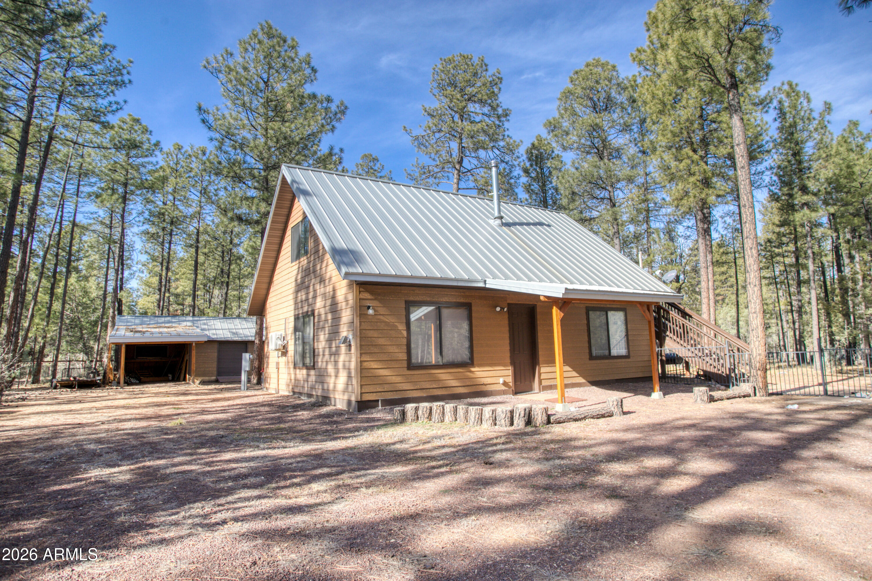 Beautifully remodeled three-bedroom home in the White Mountains of Arizona, currently operating as successful short-term rental/rentals. The layout can easily be converted into a true three-bedroom home by adding an interior spiral staircase which is included in the sale of this home(Installation not included) or the upstairs can continue to function as a private guest suite with a full kitchen.A recent, complete remodel—including an addition of approximately 1,100± square feet—brings the total living space to approximately 1,600 square feet. The home sits on one flat, pine-tree-covered acre, offering privacy, space, and a serene mountain setting.Inside, the home features newer appliances, upgraded flooring, and large windows that provide abundant natural light. SEE The open and split floor plan is both functional and inviting, designed to meet the expectations of today's discerning buyers. One large bedroom is located on the main level and two additional bedrooms with apt style kitchen suite on the second floor.Additional features include a two-car carport, RV parking with hook-ups, a workshop, outdoor barbecue area, and ample privacy. Located in a quiet neighborhood, the property is close to shopping, dining, and the hospital, while still surrounded by pristine ponderosa pines. Rainbow Lake is nearby, offering fishing and boating opportunities. Horses are allowed, no HOA, and the versatile layout makes this property ideal as a full-time residence, mountain retreat, or income-producing investment. One of the owners is a licensed real estate agent in the state of Arizona.

Imagine waking up to stunning mountain vistas, crisp, clean air, and the promise of a day filled with excitement. Here in the White Mountains, that dream can become your reality.
Whether you're an outdoor enthusiast, a culture seeker, or simply looking for a peaceful escape, the White Mountain area has something for everyone. Here's a glimpse of the adventures that await-
Outdoor Recreation:
-Tee off on pristine golf courses.
-Cast your line in over many miles of rivers and streams, and an abundant amount of stunning lakes teeming with fish.
-Embark on thrilling hunting expeditions.
-Explore rugged terrain on exhilarating four-wheeling adventures.
-Hike scenic trails with breathtaking views.
-Enjoy boating and water sports on sparkling lakes.
-In winter, carve down powdery slopes while skiing or snowboarding.
-Experience the thrill of sledding in winter wonderlands.
Wildlife & Nature-
-Observe abundant wildlife with Elk, Deer and diverse bird species and other wildlife in their natural habitat.
Entertainment & Culture-
-Exciting gaming venues at the local casino.
-Perfect your aim at target shooting ranges.
-Immerse yourself in vibrant seasonal festivals.
-Admire classic automobiles at captivating car shows.
-Indulge in fine dining experiences.
-Enjoy live musical entertainment.
-Experience an exciting day and night life.

The White Mountain area is renowned for its unparalleled beauty. With the many pristine lakes, rivers and streams, you'll be surrounded by stunning natural landscapes. Imagine waking up to panoramic views, breathing in the fresh mountain air, and exploring the countless hidden gems this region has to offer.

Beyond the recreational opportunities, the White Mountains offer a peaceful and serene environment to call home. Escape the hustle and bustle of city life and embrace a slower, more meaningful pace.

Visit the White Mountains and experience the magnificence for yourself. Discover the perfect setting for your dream home and create memories that will last a lifetime. You can look forward to being welcomed to this vibrant community!