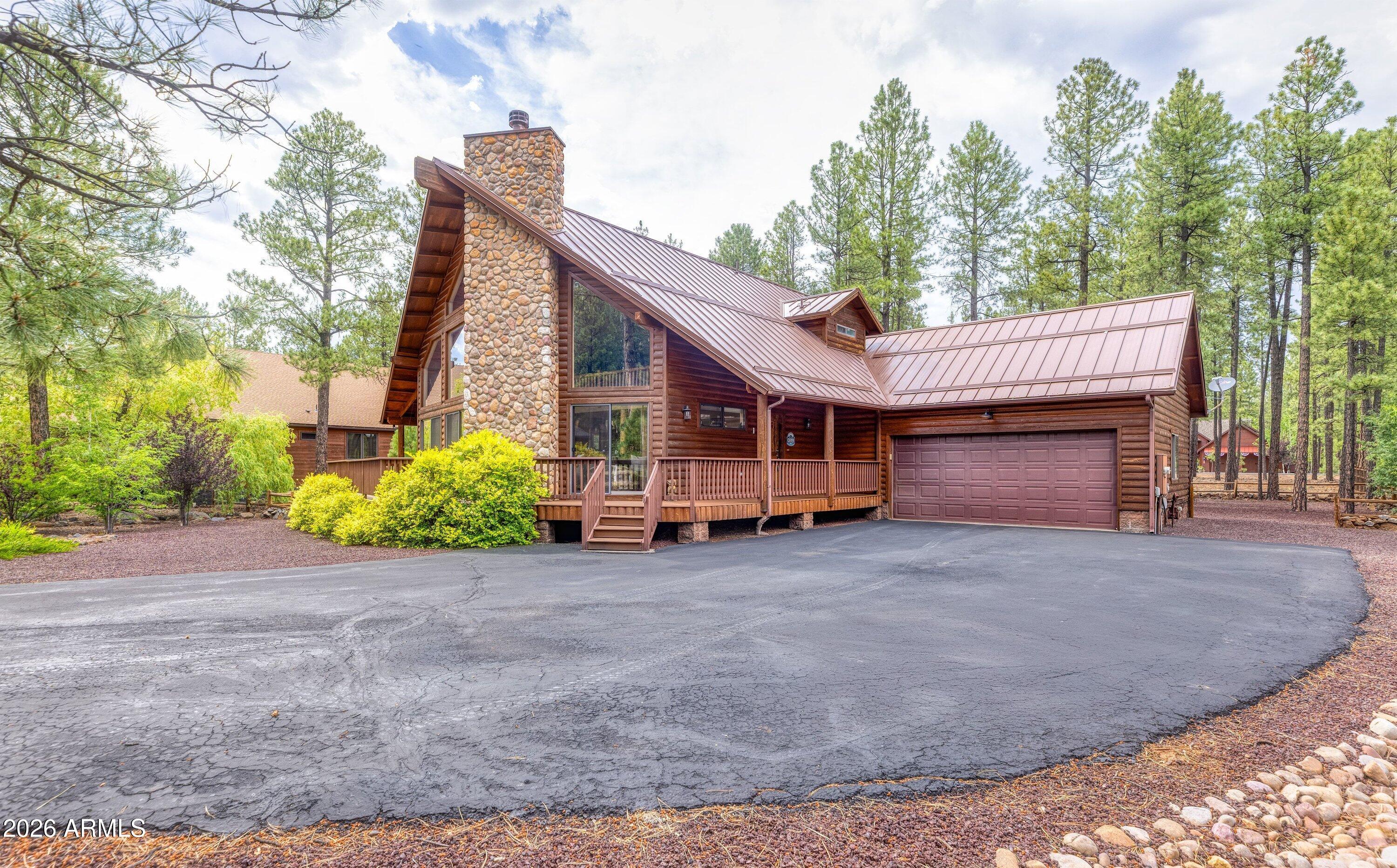 Tucked away in the highly desirable gated Starwood Estates within Pinetop Country Club, this stunning 3 bedroom, 3 bath mountain retreat offers the perfect blend of rustic charm and comfort among the tall pines. The great room welcomes you with soaring wood-plank ceilings, dramatic floor-to-ceiling stone fireplace, and expansive windows that flood the home with natural light and forest views. The open-concept kitchen features granite countertops, ample cabinetry, and a generous breakfast bar--ideal for gathering after a day in the mountains. The spacious downstairs suite provides a peaceful escape with deck access and an ensuite bath, while additional bedrooms and baths offer ensuites for guests. A versatile loft room adds extra living space. Enjoy outdoor living on the wraparound deck overlooking beautifully landscaped grounds and towering pines. With an attached garage, quality finishes throughout, and a prime location near golf, dining, and year-round recreation. Walking distance to national forest trails. This exceptional home is ideal as a full-time residence or mountain getaway.

Living in **Pinetop Country Club** means enjoying a true mountain lifestyle wrapped in a welcoming, close-knit community. Surrounded by towering pines and crisp alpine air, residents love the peaceful setting paired with an active, social atmosphere. The community is anchored by championship golf, scenic walking paths, and easy access to hiking, biking, fishing, and winter recreation. Neighbors often gather for casual rounds of golf, clubhouse dining, and seasonal events, creating a friendly, small-town feel while still being close to dining, shopping, and local amenities. Whether you're seeking full-time mountain living or a relaxing second home, Pinetop Country Club offers a refined yet laid-back lifestyle that keeps people coming back year after year.