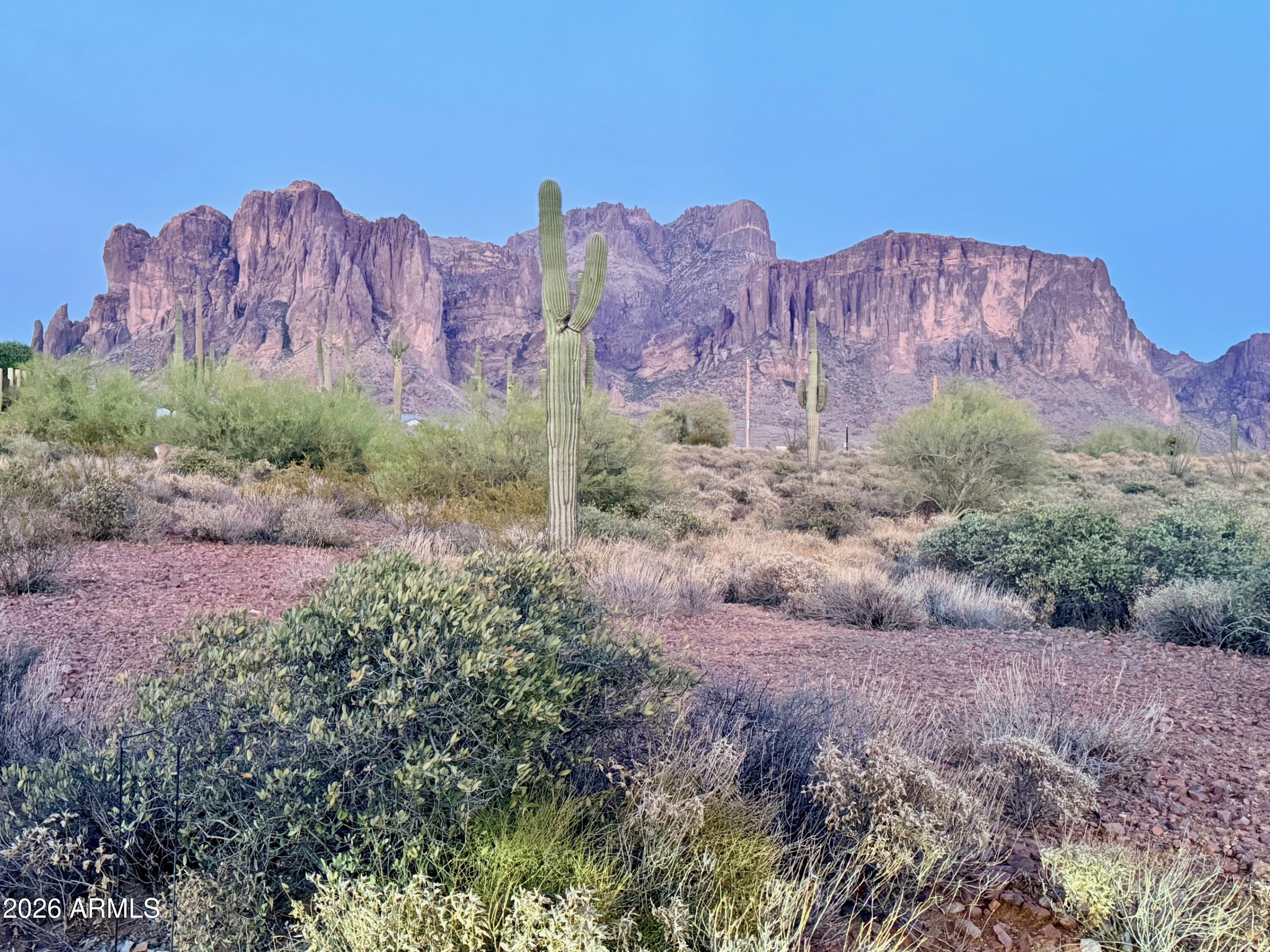 Build your dream where the desert stretches wide and the Superstitions steal the show. This 1.25-acre homesite offers breathtaking mountain and desert views. The kind that make you pause, coffee in hand, and just be. Tucked beside a stunning custom home, this parcel gives you options: design your own masterpiece or secure it alongside the neighboring property to preserve your privacy and open space (because neighbors are great... in moderation).
Shared well agreement in place or Arizona Water Company available. SRP Electric available so you're already ahead of the game. This isn't just land... it's your blank canvas under an Arizona sky. Plus, it's strategically located near lakes, parks, hiking trails, golf courses, shopping spots, and restaurants. A blend of comfort and convenience.