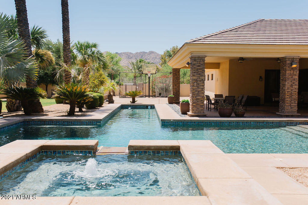 CUSTOM FAMILY HOME WITH A WARM CRAFTSMAN INFLUENCE.  RESORT STYLE SOUTH BACK YARD HAS A SPA, POOL, LAP POOL, SPORT COURT AND A DEEP COVERED PATIO.  SPLIT FLOOR PLAN OFFERS 4 ENSUITE BEDROOMS WITH WALK IN CLOSET PLUS A TRUE BUILT IN STUDY AREA .  
THE PRIMARY BEDROOM  HAS A LUX BATHROOM AND  OVERSIZED CUSTOM WALK IN CLOSET WITH SEPARATE EXERCISE ROOM.  LAUNDRY ROOM / WORK SPACE / MUDROOM / STORAGE AREA ARE ALL CONVENIENTLY LOCATED BY THE GARAGE. PLUS THE ATTACHED CASITA CAN DOUBLE AS A PLAYROOM .  PRIVATE OFFICE IS SECLUDED YET CLOSE TO THE WALK IN WINE ROOM.  MATURE LANDSCAPE CREATES COMPLETE PRIVACY .  ALL ONE LEVEL , NO STEPS.  NO HOA.   ENJOY THREE C'S SCHOOLS PLUS A WONDERFUL NEIGHBORHOOD TO WALK WITH KIDS AND DOGS.  FIRST TIME ON THE MARKET .
