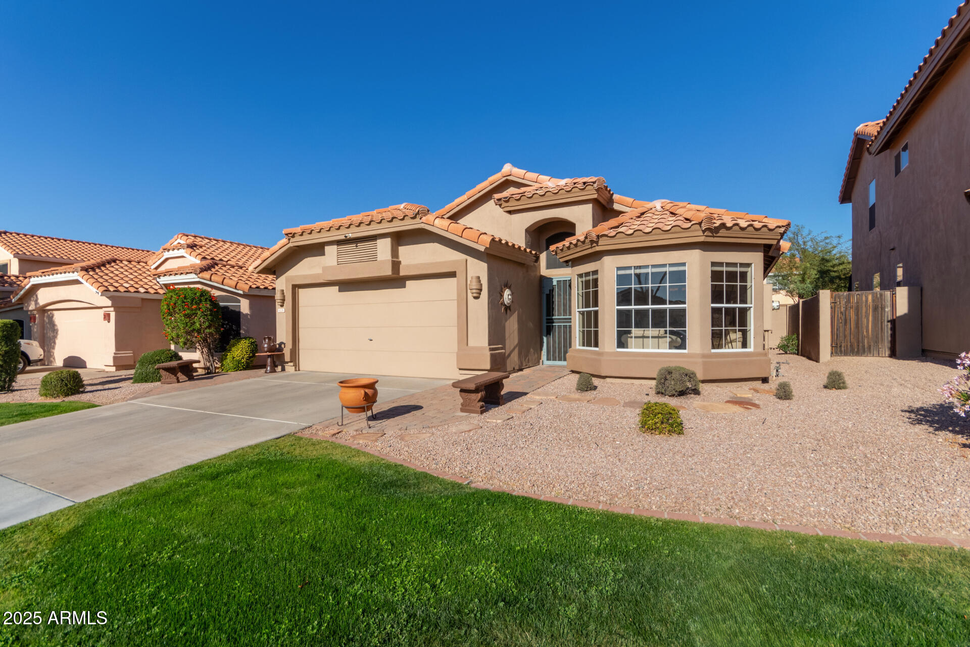 You won't want to miss this immaculate, move-in ready home in the highly sought-after Red Mountain Ranch community! Perfectly located just minutes from the Loop 202, this home offers the ideal blend of comfort, convenience, and low-maintenance living.

Step inside to soaring vaulted ceilings, upgraded 20'' tile in all the right places, and an open, inviting layout designed for easy living and entertaining. The open-concept kitchen and family room flow seamlessly together, creating the perfect space for gathering with friends or enjoying cozy evenings by the fireplace. The bedrooms feature no carpet flooring, adding both style and easy maintenance. Designed for effortless Arizona living, the backyard showcases beautiful pavers and low-maintenance xeriscape landscaping, perfect for relaxing without the upkeep.

Even better, the HOA maintains the front yard, making this an ideal lock-and-leave property for seasonal residents or busy homeowners.

Outdoor enthusiasts will love being close to hiking and Usery Mountain Regional Park, offering miles of scenic trails and incredible desert views. Also easy access to the Salt River and Saguaro Lake.

Just a few blocks away, you'll also find Red Mountain Ranch Country Club, where memberships are available for golf, tennis, pickleball, fitness amenities, dining, and more.

With a fantastic location, wonderful neighbors, and easy access to shopping, dining, recreation, and freeways, this home truly offers the best of Arizona living.