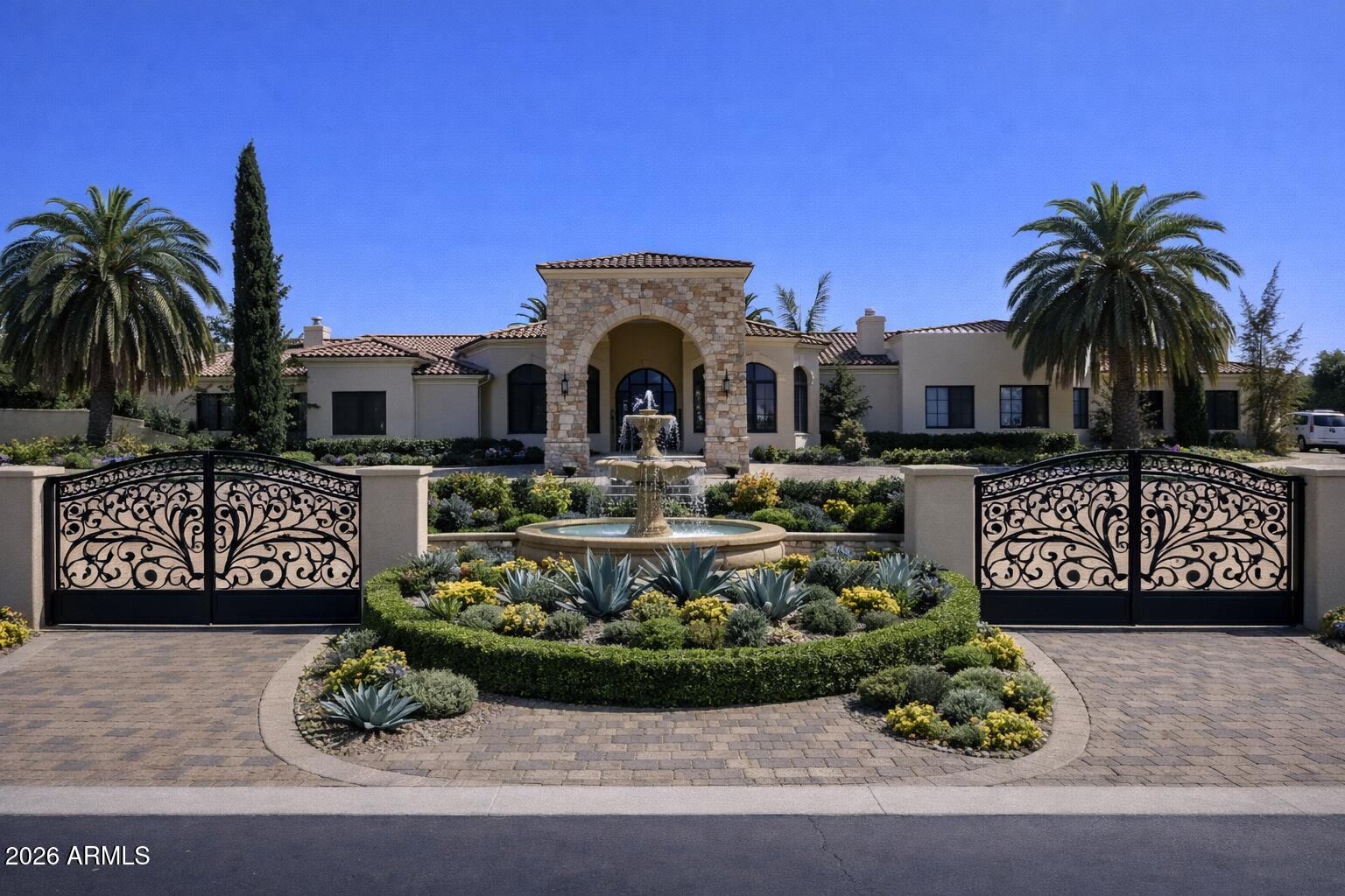 Nestled in the heart of Paradise Valley on 1.27 acres, this nearly 9,800 sq ft estate offers 6 bedrooms, 6 full and 2 half baths, blending luxury with thoughtful design. The expansive layout features a massive chef's kitchen with dual islands, gas cooktop, and double ovens, opening seamlessly to elegant living spaces with stunning Camelback Mountain views. The private master wing includes dual closets, vanities, toilets, a steam shower, and direct access to a rare indoor lap pool. Outdoors, enjoy a resort-style pool and spa. Complete with a 4-car garage, this home delivers exceptional comfort, privacy, and premier location living. privacy, a large walk-in closet for effortless organization, and an elegant bathroom with a separate shower & tub. The large office displays beautiful coffered ceilings and walls, with built-in shelving, making it perfect for a study room or workspace. Step outside to find your backyard oasis, featuring abundant seating space with travertine pavers, an expansive covered patio perfect for entertaining, a built-in BBQ, a relaxing spa, and a sparkling pool. This home is beautifully designed to be a paradise for you and your loved ones, offering the perfect blend of luxury, modern comfort, privacy, and mountain views. Just WOW!
