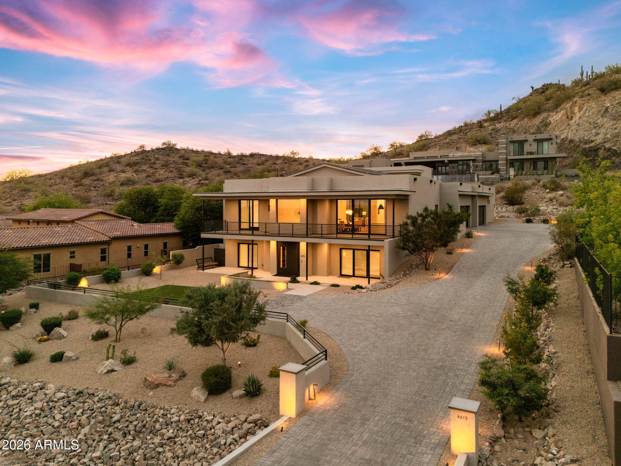 Stunning 3-year-old desert contemporary residence in gated hillside community offering 7,700+ SF of refined modern living. Features 12-ft flat ceilings in most rooms and an impressive 18-ft ceiling in great room. The home includes 6 bedrooms, 5.5 baths, plus a third-level interior suite with bedroom, bath, and loft ideal for guests or private retreat.

Expansive chef's kitchen with oversized statement island flows into open living and dining areas. Three gas fireplaces enhance comfort and ambiance. Walls of glass capture mountain and city views from most windows and extend living spaces to covered patios and decks.
A private atrium courtyard serves as the centerpiece for outdoor living, featuring an infinity-edge pool with heated spa perfect for entertaining and private dining. Designed for true single-level luxury living with more than 5,700 SF on the main floor, where the kitchen, entertaining areas, and garage access flow effortlessly together.

It was built with the newest technology block construction look up ICCF BLOCK to know more about the amazing benefits of integrated composite concrete blocks. ONLY 516$ a square foot at this price!
Wolfe appliances in Kitchen and Subzero wall refrigerator and freezer.  48" gas range
DON"T MISS THE VIDEO...