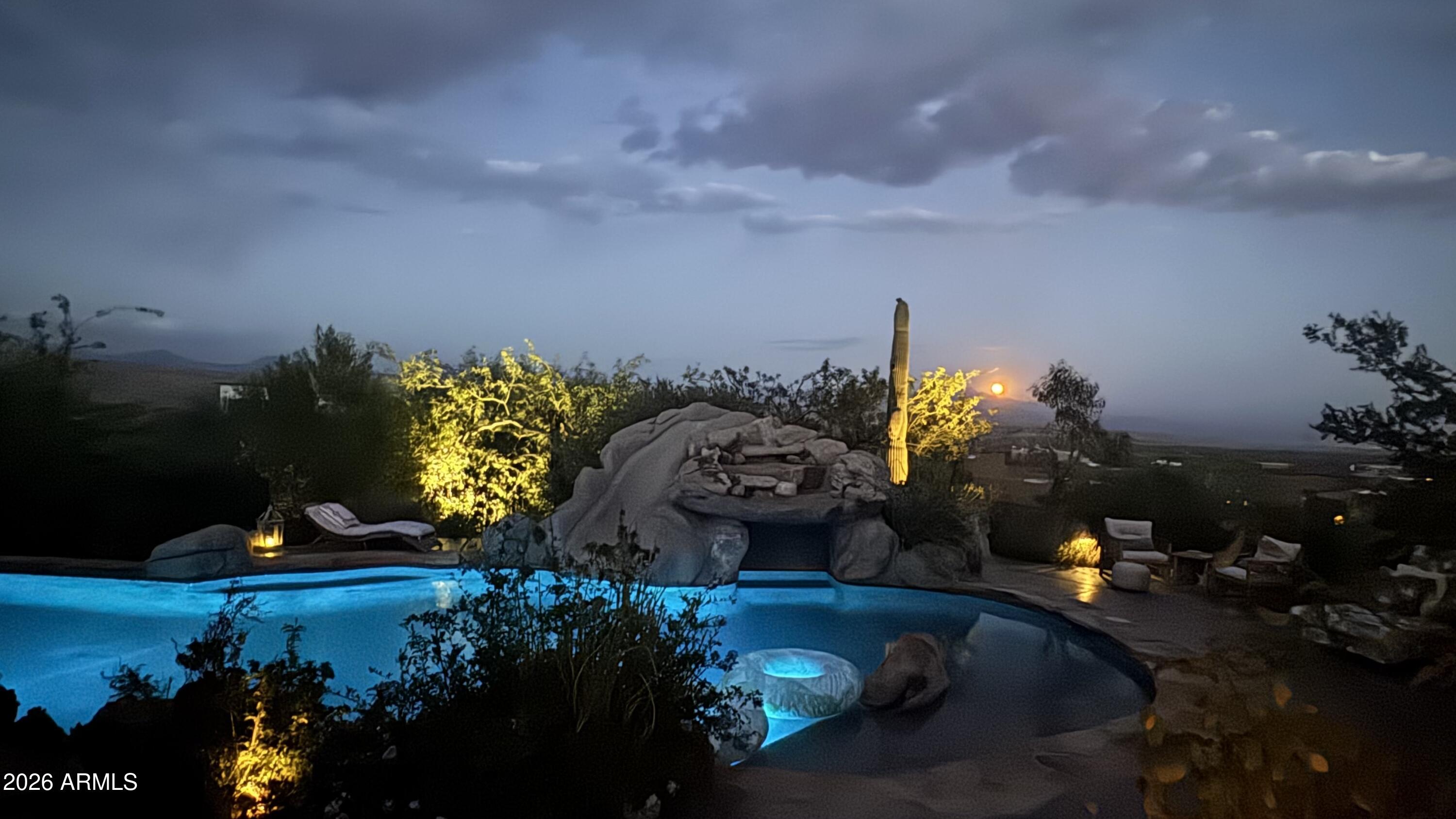 Custom pretty pueblo ideally seated on 3.5 acres for total privacy with multiple outdoor lounge/dining areas and spectacular vistas/views of Four Peaks, Weaver's Needle with Tonto National Forest surrounding. Three en-suite bedrooms, dedicated office with new wood flooring, new HVAC's, new appliances and new custom interior and exterior lighting. Botanical secret gardens curated for the enjoyment of all in residence enchant year round. The pool patios are totally private with covered dining multi lounge areas that capture the Sonoran skies at their most beautiful. Remodeled primary suite and guest suite with hand painted tile in both. This offering includes 2 parcels.