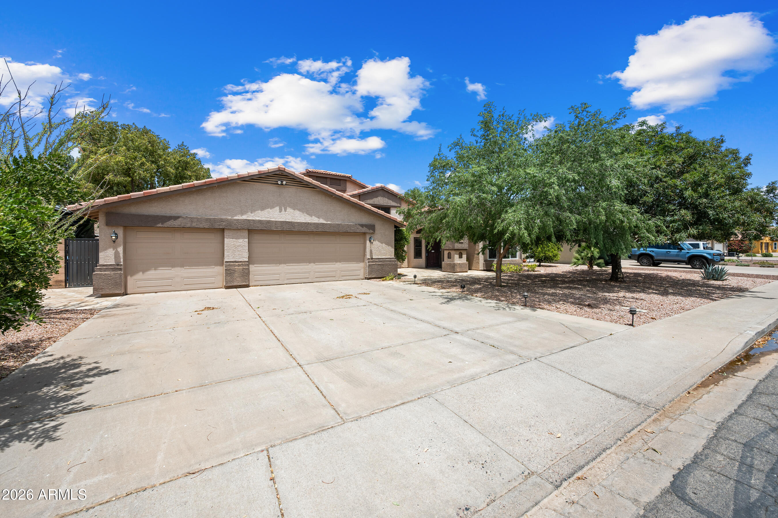 Welcome to this Stunning 3,110 Sqft, 5-Bedroom, 3-Bath Home with a 3-Car Garage and NO HOA! From the moment you step inside, you'll appreciate the thoughtful updates and designer touches throughout, including imported Italian tile, engineered hand scraped wood flooring, wood plantation shutters, recessed lighting throughout, and spacious living areas designed for both comfort and entertaining. The beautifully updated kitchen features stainless steel appliances, granite countertops, a large island with breakfast bar, microwave nook, front storage, real wood cabinetry with under mount lighting, modern hardware, luxurious granite backsplash, oversized single-basin sink and a cozy dining nook. The lower level offers a warm and inviting wood-burning fireplace, secondary living space, and 2 private guest bedrooms with an updated bath showcasing a custom vanity, leathered granite countertops, tile-surround walk-in shower and modern backlit mirror. The oversized primary suite is a true retreat with vaulted ceilings, a private balcony, freestanding soaking tub with designer tile wall, separate glass-enclosed tile shower, dual-sink vanity with backlit mirror and storage nook, a large walk-in closet and private water closet. Step outside to an entertainer's dream backyard featuring a covered patio with travertine extension, alumawood pergola, propane fire pit, lush grass, garden area, raised garden bed and an oversized Tuff Shed complete with loft and electrical. Additional highlights include epoxy garage flooring and built-in garage cabinetry. This beautifully upgraded home combines style, function and flexibility in a highly desirable NO-HOA setting.