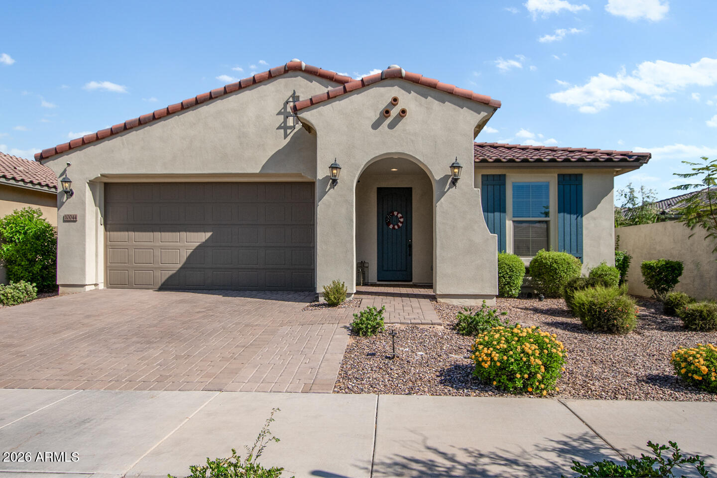 Welcome to Your Dream Home in Eastmark! This split 4 -bed, 3-bath gem is the ultimate choice for those seeking the perfect blend of luxury and comfort. Step inside, and you'll be greeted by the elegance of 9-ft ceilings and newer light fixtures that illuminate this exquisite home. The living room boasts Luxury Vinyl Plank flooring, providing both style and practicality. The heart of the home, the kitchen, is a culinary delight with its beautiful granite counters, a mosaic backsplash that adds a touch of artistry, and sleek stainless steel appliances that make cooking a breeze. Whether you're hosting a gourmet dinner or enjoying a casual breakfast, this kitchen has you covered. The versatility of this home truly shines with its enclosed den-  Use as a 4th bedroom .... Use it as an additional bedroom for guests or transform it into your ideal office space - the choice is yours.

The primary bedroom is a sanctuary in itself. You'll love the spacious bathroom, complete with a separate tub and shower, and an oversized walk-in closet. Pamper yourself in luxury every day.

Step outside into your own private oasis. The backyard is a true haven, featuring a covered patio where you can relax with a good book or entertain friends. Practice your putting skills on the green or unwind in the separate seating area under the Arizona sky.

But the Eastmark community itself is where the magic happens. Dive into resort-style living with access to a community pool, a recreation center for endless fun, a skate park for the adventurous, and a recreational fishing lake for serene moments by the water. Explore the dozens of community parks, grab a bite at the local diner, shop for fresh produce at the farm store, and savor your favorite brew at the nearby coffee shop. Enjoy the events that give you an opportunity to connect with your neighbors.