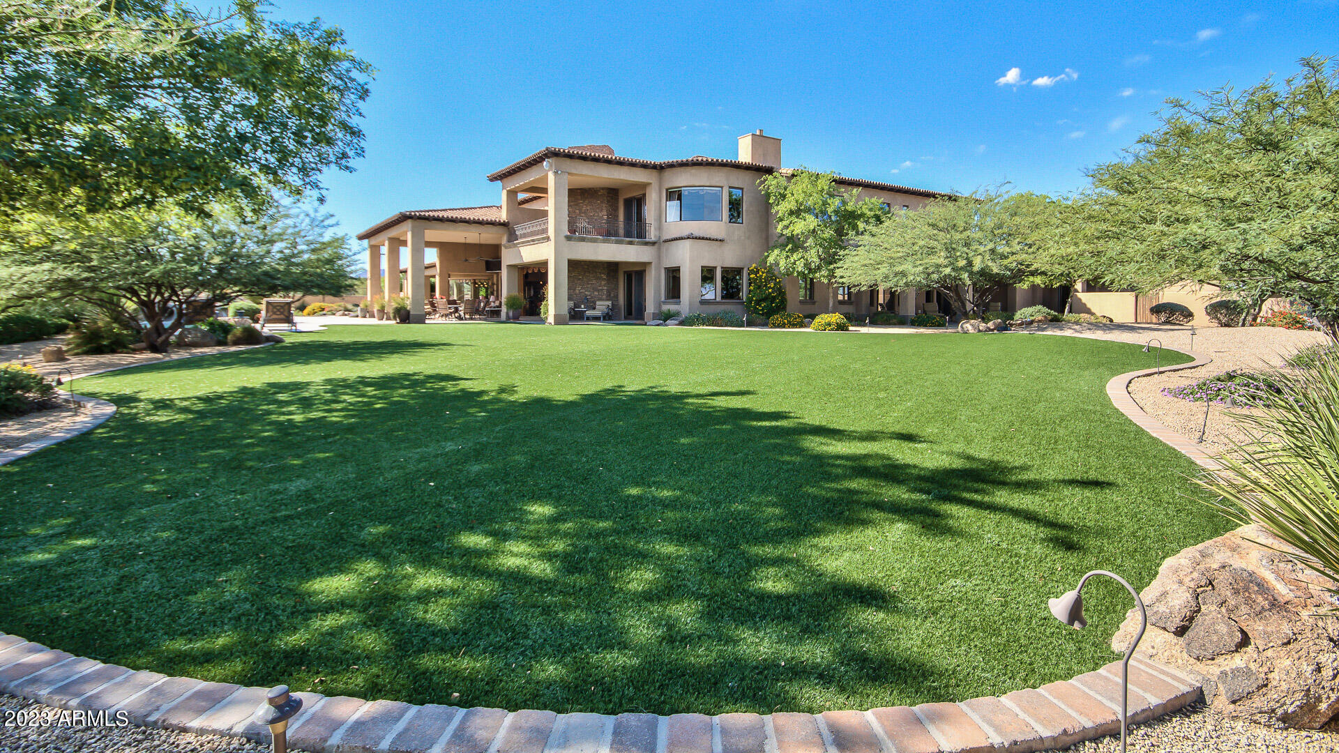 Utopia Oasis on 5 acres with large private water well. 
Enter into an elegant and expansive lodge-like open living area with soaring beamed ceilings,game room & movie theater. 
Enjoy your Gourmet chef's kitchen complete with top quality appliances & massive granite island. 
Three huge bedrooms suites downstairs. Elevator to access the second master suite and balcony plus additional wing with 3 more on-suite bedrooms. 
+A Beautiful complete Casita! 
Entire home is built with Concrete block construction for superior strength and insulation. The inside of home is finished with the finest materials and craftsmanship. Gated with paver drive, huge garage & paver car court. 
The very large McDowell Mountain Preserve is your Backyard.