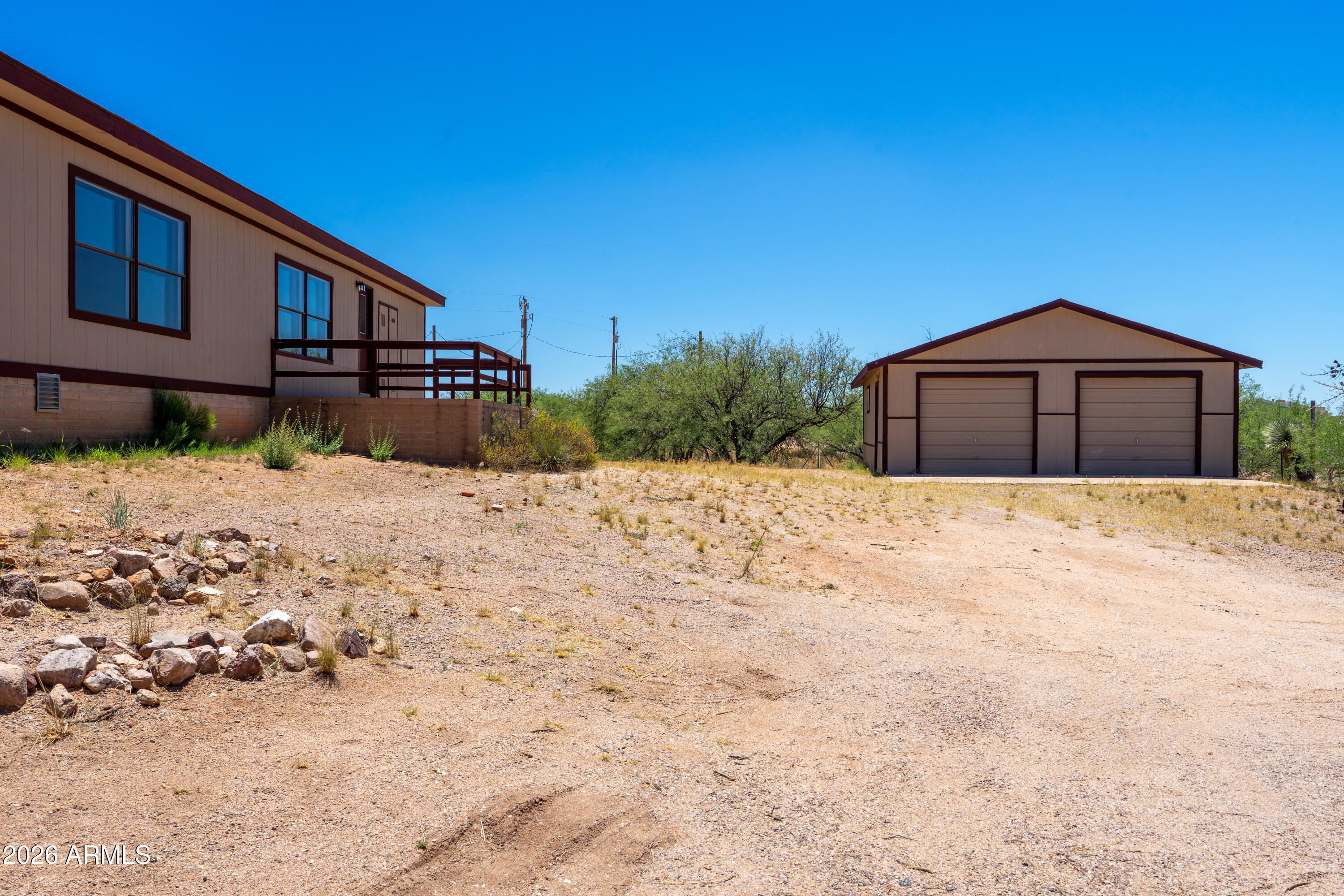 This BEAUTIFULLY REMODELED 1770sf 3BD 2BA is located on 2.84ACRES (double lot) of HORSE PROPERTY. 24 X 30 Workshop/Garage. PLUS separate building suitable for a studio, craft/hobby, home office or whatever your space needs may be. Additional storage building with power and water. Spacious living area. Large island kitchen with brand new granite counters and new appliances. Split floorplan with ample primary suite with dual sinks and granite in the bath. Gorgeous new LAMINATE flooring throughout. Brand NEW HVAC system. Brand NEW WATER HEATER. 1/2 well share. Beautiful MOUNTAIN VIEWS! Paved road access. Conveniently located with easy access to commute to Tucson, Benson, Sierra Vista, Willcox.