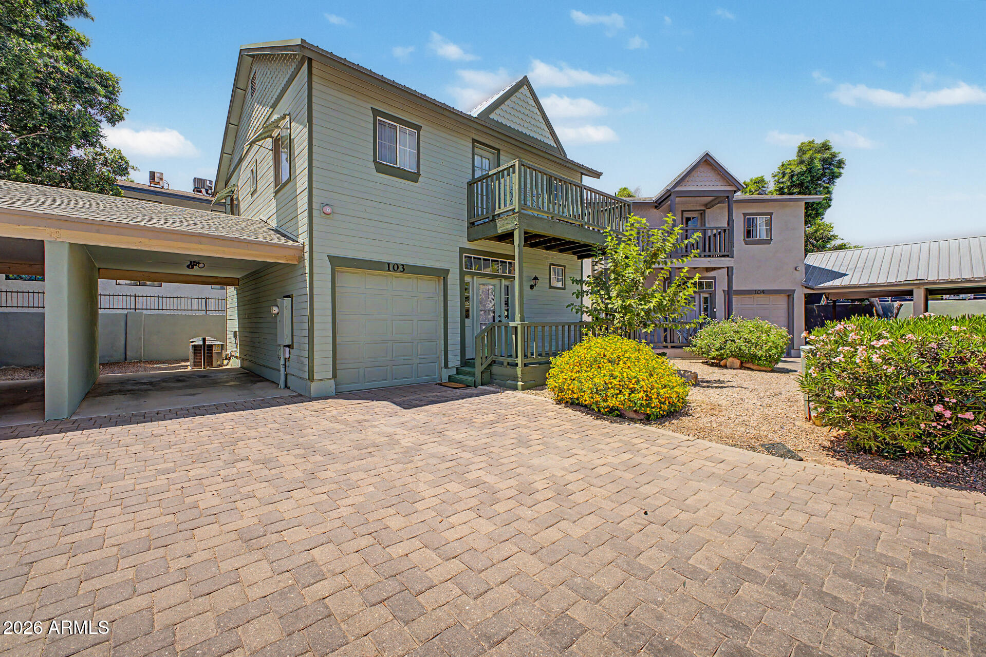 Great opportunity! This move-in-ready, low maintenance and HOA  townhome is the one you've been waiting for. From the moment you arrive, you'll find carport parking, a 1-car garage, & a cozy front porch ideal for enjoying quiet mornings. Sleek interior features wood-look flooring, ceiling fans, & recessed lighting that illuminates every corner. Inviting & bright great room is thoughtfully designed for everyday living & entertaining. The kitchen has built-in appliances, granite counters, & plenty of cabinets. Sizable main bedroom offers outdoor access & a bathroom for added comfort. In the basement, you'll have a bonus room perfect for a TV area or office & an additional bedroom. After a busy day, unwind on the balcony while sipping your favorite drink. PLUS! Close to the ASU campus. Don't let this gem slip by