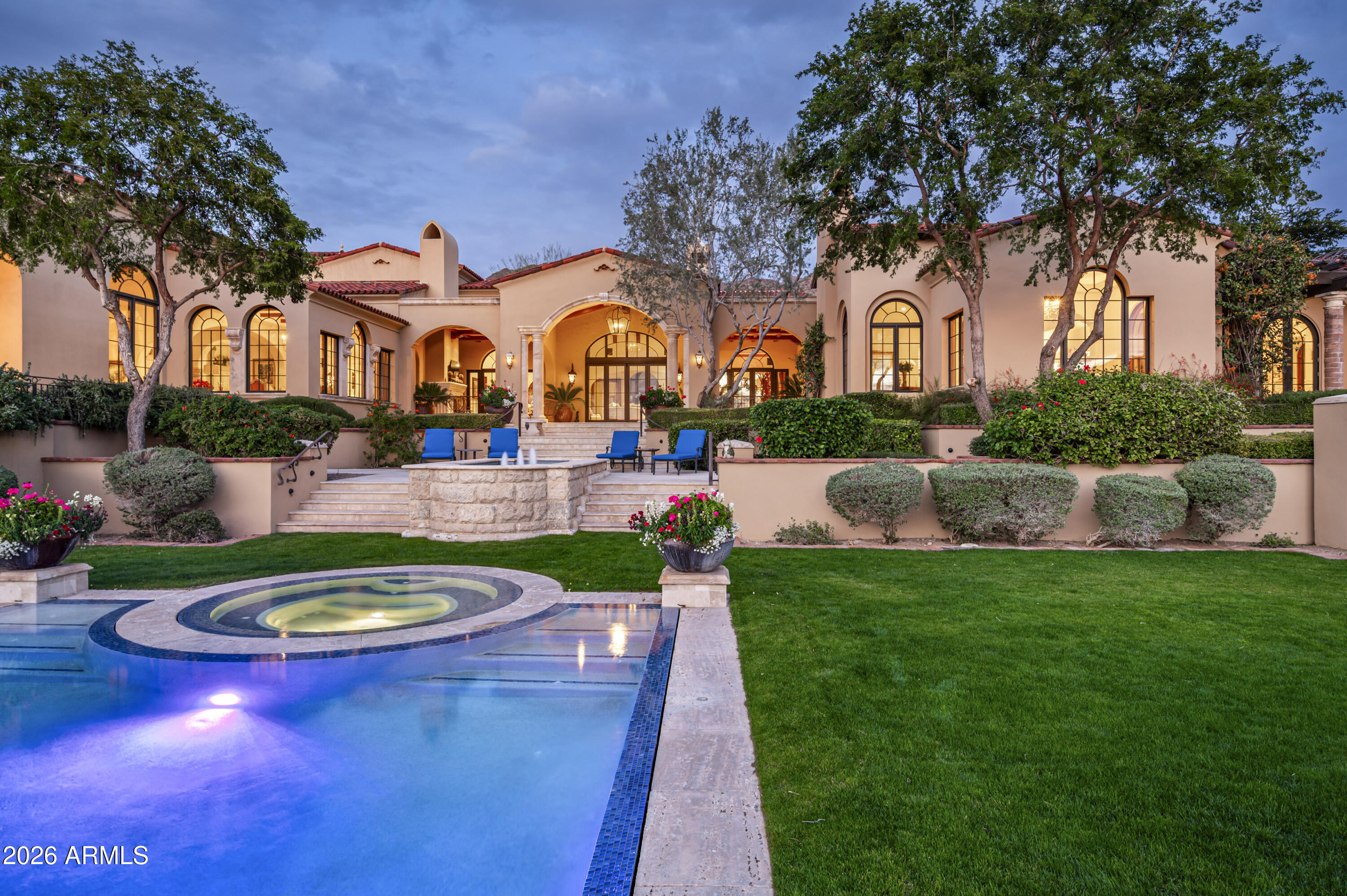 SILVERLEAF CLUB GOLF MEMBERSHIP AVAILABLE - Set on 3.6 private acres in the coveted Upper Canyon of Silverleaf, this exceptional Mark Candelaria designed Mediterranean estate embodies the pinnacle of luxury living in Scottsdale's most exclusive enclave. Crafted with exquisite architectural detail and maintained to perfection, this 10,429 sq. ft. residence offers a seamless blend of refined elegance, privacy, and sophistication. The home welcomes you with intimate courtyards, graceful archways, and hand-crafted finishes throughout. Thoughtfully designed living spaces flow effortlessly between indoors and out, capturing panoramic mountain vistas to the north and east and glowing city lights and sunsets to the west. The main residence offers five ensuite bedrooms and seven and a half baths, including a luxurious primary wing with a private sitting room, dual his-and-her bathrooms, and custom dressing areas. A richly appointed library/office, custom theatre, temperature-controlled wine room, and a series of charming loggias and patios create a sense of resort-style comfort and quiet elegance. A 928 sq. ft. detached guest casita provides an ideal retreat for guests, complete with a full kitchen, living room, and bath. The lushly landscaped grounds feature tranquil gardens, shaded terraces, and a private auto court with six-car garages, offering both beauty and functionality. Residents of Silverleaf enjoy an unparalleled lifestyle within the guard-gated Silverleaf Club, home to one of the Southwest's most celebrated Tom Weiskopf-designed golf courses, a world-class spa and fitness center, and elegant dining and social venues that foster a true sense of community and exclusivity. This estate is a testament to timeless design and desert luxury - an extraordinary retreat for those who value beauty, craftsmanship, and the ultimate in Arizona living.