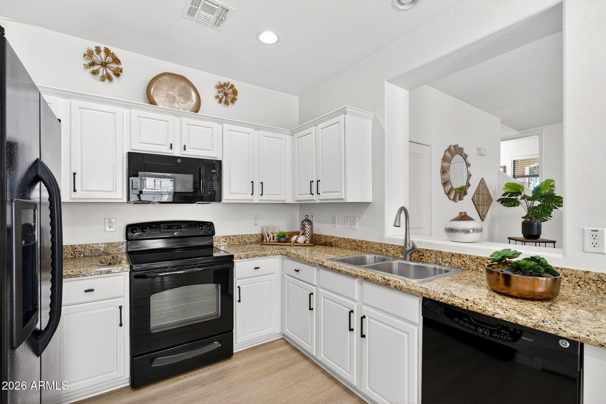 Welcome home to the heart of Gilbert at Village at Spectrum! This beautifully updated 3-bedroom, 2-bath gem checks every box with new flooring, crisp white cabinets, stylish new fixtures, and a fresh modern feel throughout. Spacious bedrooms with an enormous primary suite complete with dual sink vanity, separate garden tub and shower and large walk in is an owners dream! Upstairs laundry with washer/dryer that convey! Perfectly positioned across from open green space and just steps from the community pool, this home offers the lifestyle buyers are searching for. Enjoy nearby shopping, dining, and entertainment at the San Tan Shopping Center. With quick access to the 202 freeway, grocery stores, restaurants, and everything Gilbert living has to offer, this location is hard to beat!