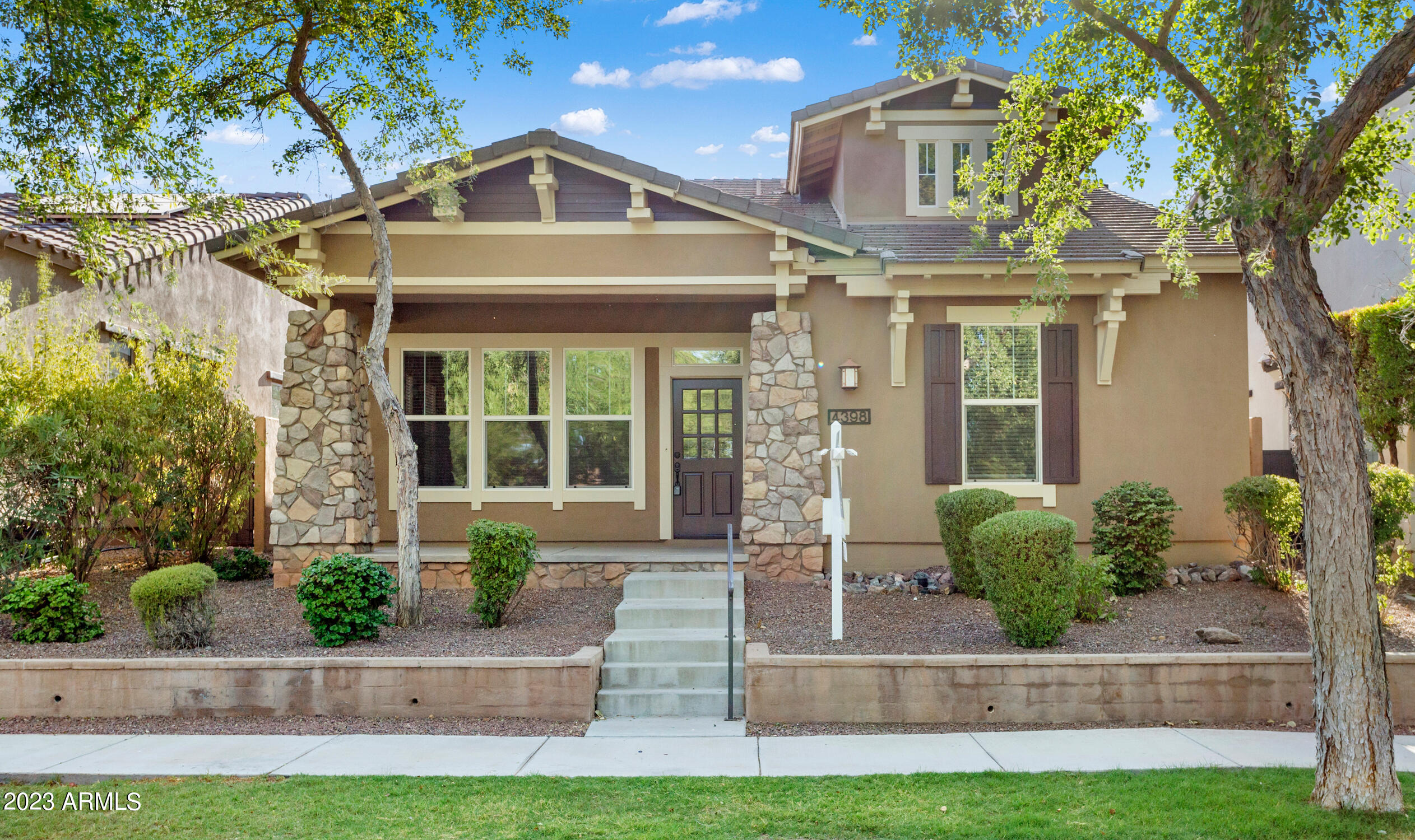 HIGHLY SOUGHT AFTER MAIN STREET DISTRICT LOCATION ON BEAUTIFUL JACKSON GREEN PARK!! Easy living in this Ashton Woods popular ''Hampton'' floor plan. Home is situated across the street from The Goddard School, Verrado Elementary, and New Sunrise Marketplace. Main Street Shops, Restaurants, Businesses, and The Center on Main with Workout Facilities and 2 pools, all just 2 blocks away. Verrado is also home to The Heritage Swim Park, Beach entrance pools and splash pads, with BBQ amenities. All of which are included in the Lease. Enjoy the chance to play 2 premiere Golf Courses as well!  The split floor plan has 3 bedrooms, 2 full baths, large front GR or Dining in addition to a private den/office.  Remodeled Primary and Secondary Bathrooms in 07/23. Refreshed interior paint throughout.