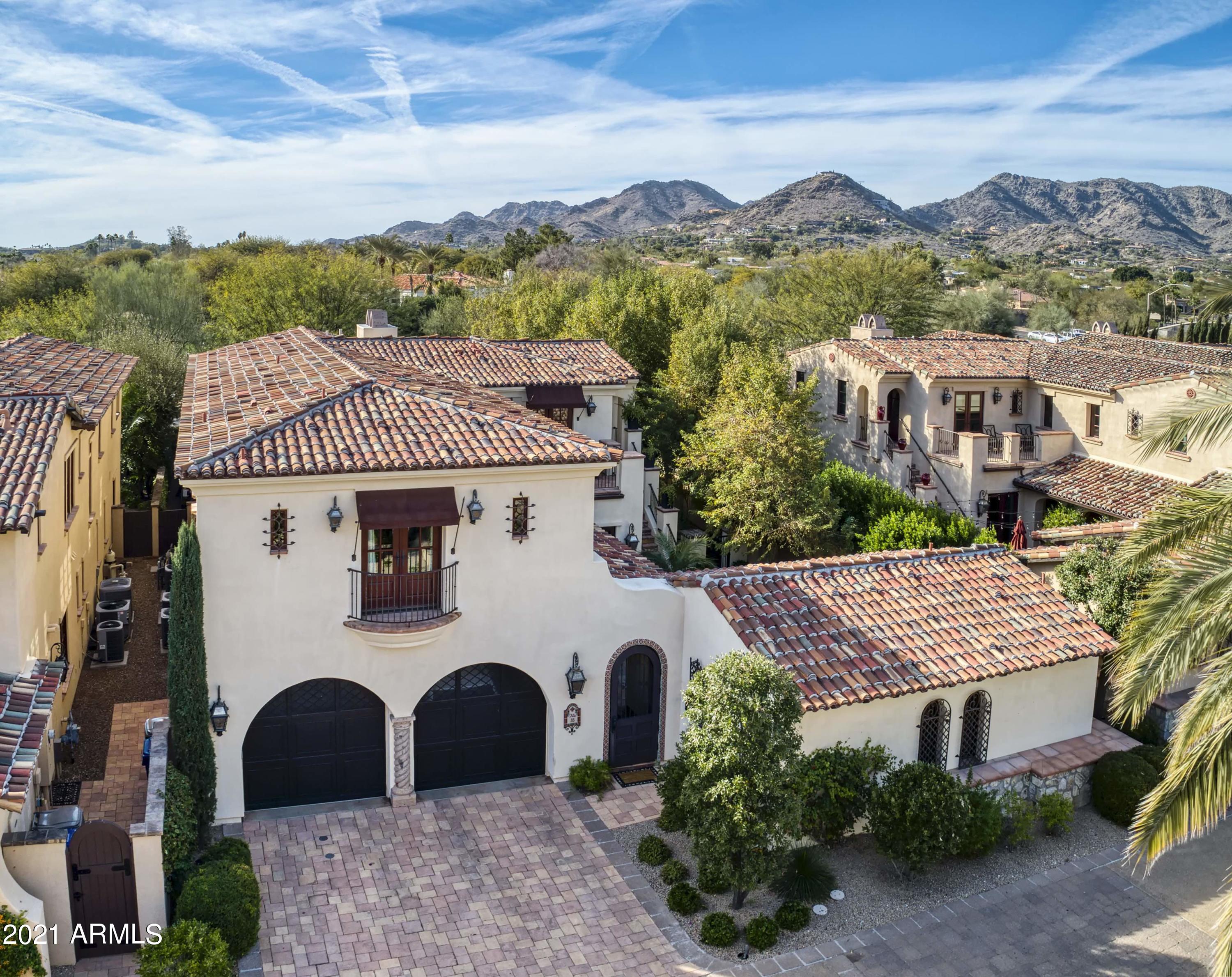 Elegantly designed & located at the base of the iconic Camelback Mountain in the very private, 24-hour guard-gated development of Montelucia.  The largest of 3 floor plans offered in community, this spacious 4815 square foot stunning Villa residence has it all, 4 large bedrooms each w/ en-suite baths & two additional 1/2 baths, walk-in closets, a beautiful Great Room featuring soaring ceilings w/ cathedral wood beams, a dining/sitting room w/ 2 wine refrigerators, chef's dream kitchen w/ all Viking appliances, 3 private courtyards with lush landscaping, outdoor grill and dining area, a private heated pool & water features, detached gym/office/bonus room w/ half bath, loft flex space, reclaimed wood flooring throughout, 2-car garage w/ wall-to-wall storage and workbench. This is a must-see exquisite Villa with Resort privileges. Villa Owners enjoy use of the 5-star Resort pools, award winning spa, 24-hour Fitness Center, restaurants, room service, discounts on food & beverage & many other Resort Services. [Floor plan in Docs Tab]