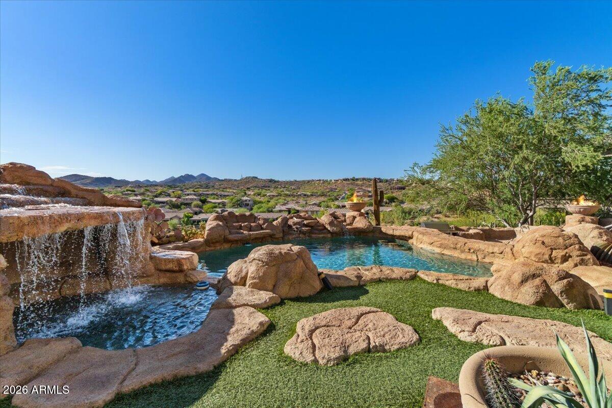 Perfectly positioned along the 2nd fairway of Eagle Mountain Golf Club, this exceptional residence captures sweeping golf course, mountain, and city light views from one of Fountain Hills' most sought-after settings.

Designed for both everyday living and unforgettable entertaining, the home offers an expansive floor plan with seamless indoor-outdoor flow and multiple gathering spaces. The walkout lower level opens to a resort-style backyard where guests can enjoy the sparkling pool and spa, generous patio areas, and breathtaking desert vistas.

The north-facing backyard provides year-round enjoyment, while the elevated setting showcases stunning views in every direction. Whether hosting a sunset dinner party, watching the city lights come alive, or enjoying a quiet morning overlooking the 2nd fairway, this home delivers a lifestyle that is distinctly Arizona.

Located within the gated Eagle Mountain community, this property combines privacy, scenic beauty, and premier golf course living just minutes from Fountain Hills amenities, dining, shopping, hiking trails, Scottsdale, and the Mayo Clinic.

A rare opportunity to own a luxury golf course home with exceptional views, a walkout design, and the ultimate entertainer's setting.