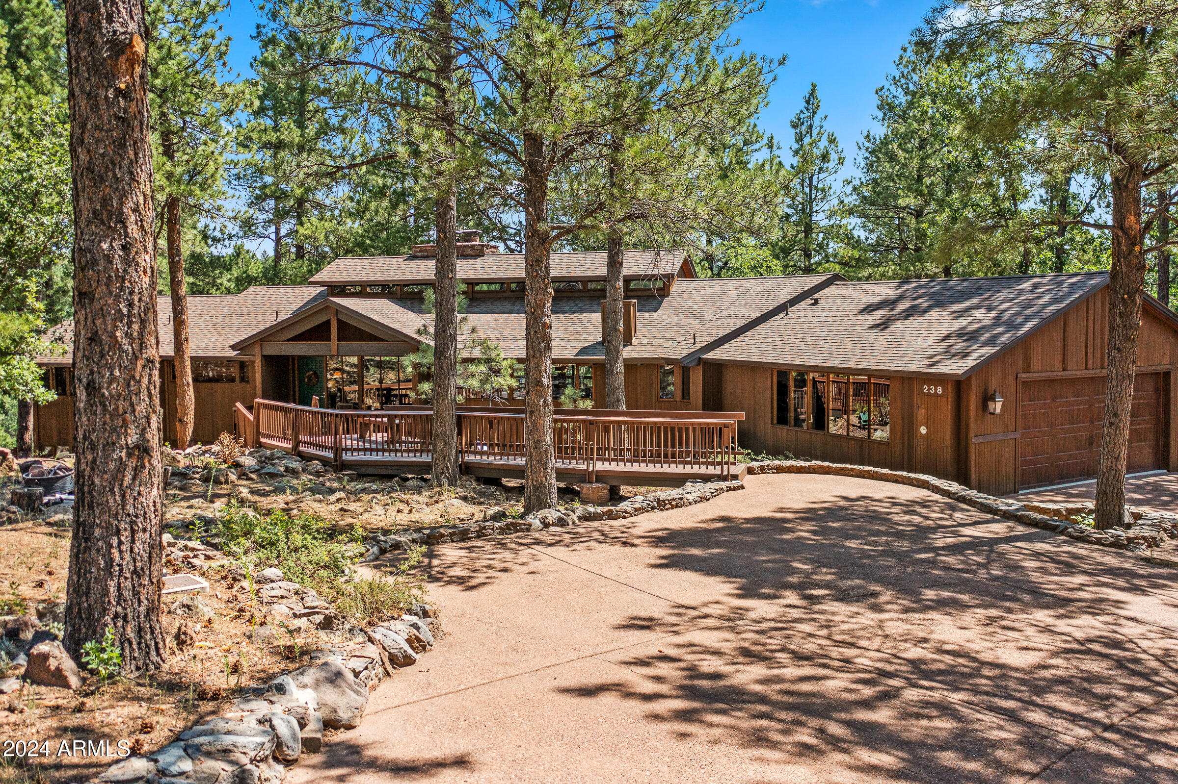 This architecturally significant post-and-beam home, crafted by the renowned Deck House/Acorn Deck House Company, embodies the mid-century mountain modern aesthetic. Showcasing beautiful teak and mahogany wood accents throughout, the residence offers floor-to-ceiling glass walls that fill every space with an abundance of natural light. With its thoughtful design, this home delivers an enchanting Ponderosa pine ''treehouse'' feel, perched above the #9 green of the Canyon Course and spanning just under an acre in a serene cul-de-sac.
Inside, a striking tongue-and-groove wood ceiling crowns the open great room, providing an inviting and expansive setting. A dedicated game room, complete with a wet bar, accompanies three fireplaces and two laundry rooms for added convenience. This home boasts a new roof installed in 2016, alongside substantial interior updates completed between 2018 and 2019, including a fully refreshed kitchen, upgraded lighting fixtures throughout, updated bathrooms, newly painted interiors, and HVAC units with added air conditioning.
The property also features a reverse osmosis water system in the kitchen, an EV charger in the garage, and multiple outdoor decks for relaxing and entertaining. For an extra touch of adventure, a treehouse hideaway for kids awaits, making this home a truly special retreat.
Tucked away amidst 1,100 acres of pristine alpine beauty, Forest Highlands exudes an unparalleled sense of exclusivity and serenity. With two championship golf courses designed by Tom Weiskopf and Jay Morrish, Forest Highlands sets the stage for unforgettable golf experiences. The community offers an array of exceptional amenities, including two clubhouses, multiple dining options, tennis courts, swimming pools, and miles of hiking and biking trails. Forest Highlands is a retreat where luxury meets nature, ensuring a harmonious lifestyle for its residents.