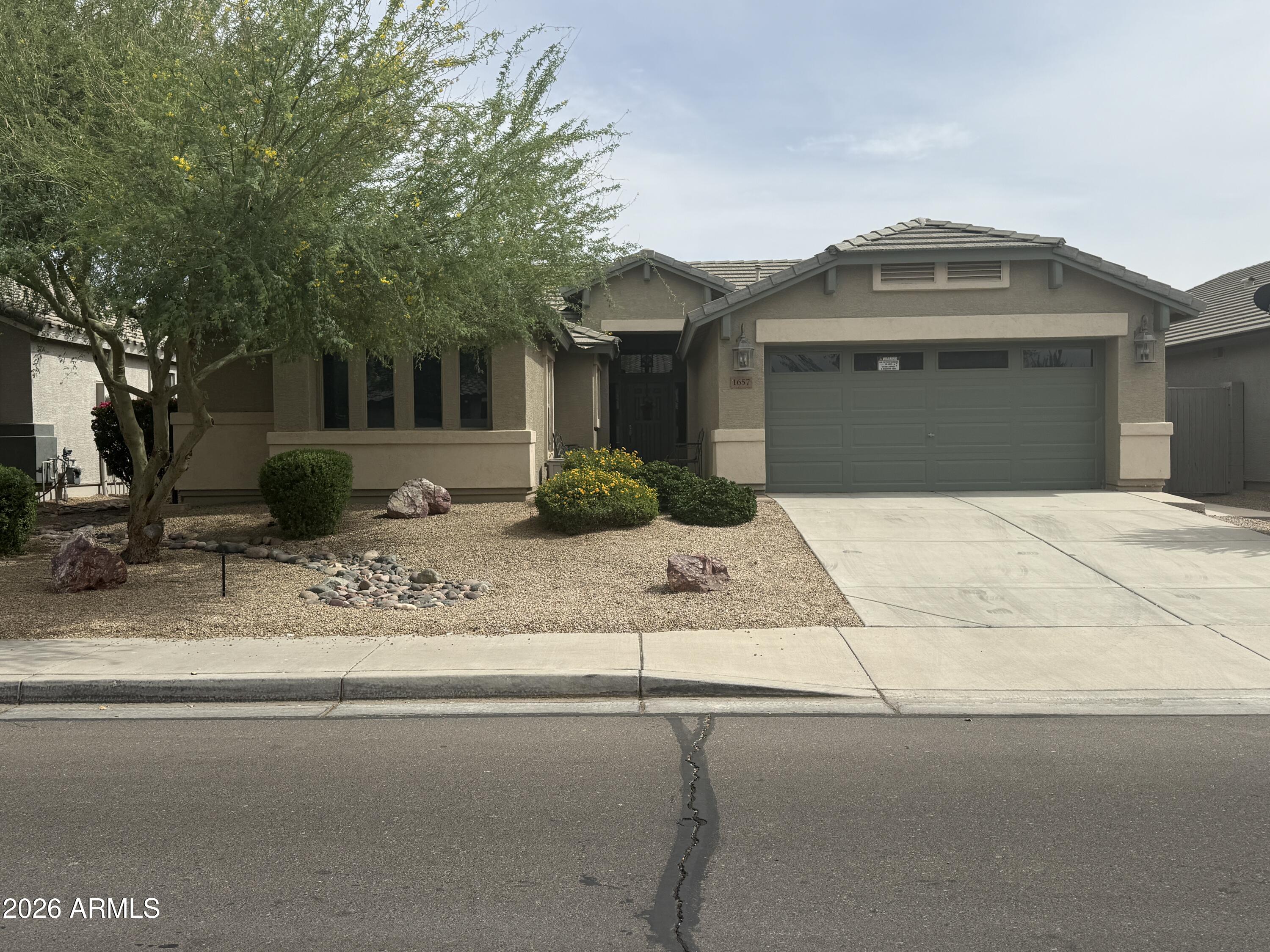 Beautiful home in the desirable Pecan Creek community featuring 3 bedrooms plus a den and over 2,100 sq ft of living space. This spacious floorplan offers open living areas, generous room sizes, and plenty of natural light throughout. The kitchen opens to the main living space, making it perfect for entertaining. Enjoy the added screened-in Arizona room for year-round indoor/outdoor living, plus a large backyard with room to relax or personalize. Conveniently located near shopping, dining, parks, and commuter routes in growing San Tan Valley.