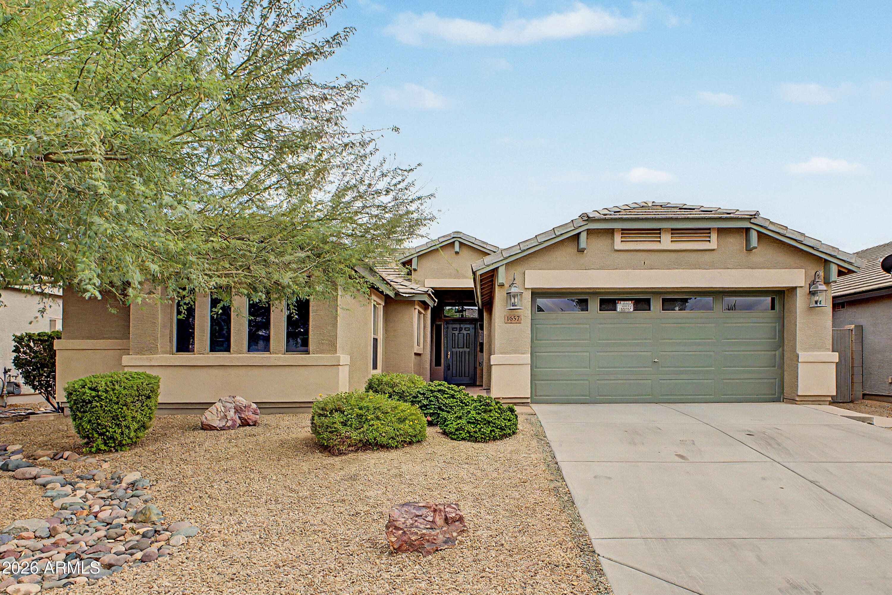 Beautiful home in the desirable Pecan Creek community featuring 3 bedrooms plus a den and over 2,100 sq ft of living space. This spacious floorplan offers open living areas, generous room sizes, and plenty of natural light throughout. The kitchen opens to the main living space, making it perfect for entertaining. Enjoy the added screened-in Arizona room for year-round indoor/outdoor living, plus a large backyard with room to relax or personalize. Conveniently located near shopping, dining, parks, and commuter routes in growing San Tan Valley.