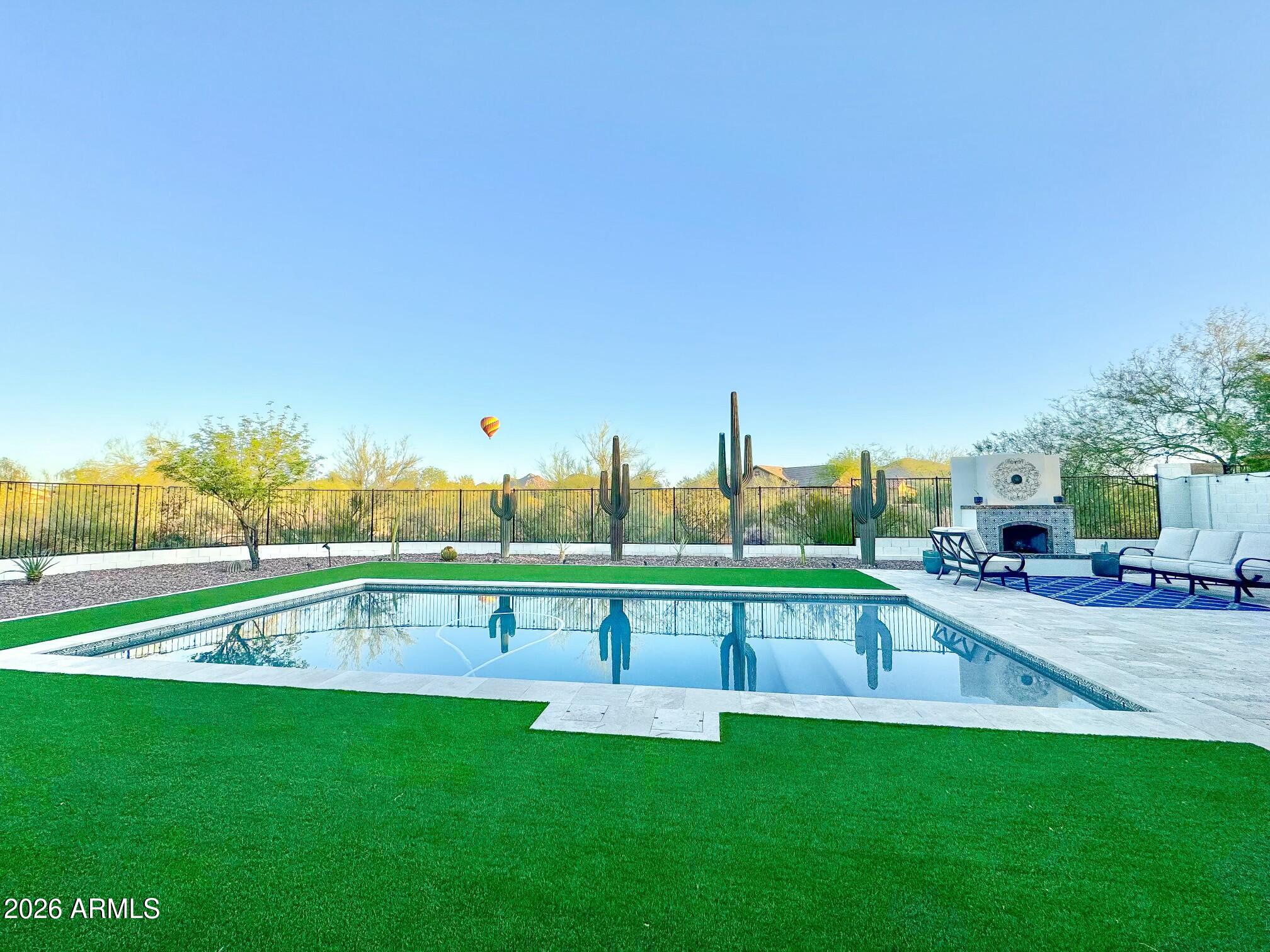 Absolute DREAM home in the prestigious gated community of Sonoran Foothills! This stunning 3,585 sq ft masterpiece has been updated from floor to ceiling -no detail overlooked. On-trend color palette with wood look tile flooring throughout and stunning kitchen and bath remodel. New roof with 30 year warranty. The backyard views are simply breathtaking, offering the kind of Arizona scenery that stops you in your tracks. Sonoran Foothills features community pool, tennis courts, pickle ball, playgrounds, and miles of biking and walking paths right outside your door. Minutes from TSMC, The Shops at Norterra, Happy Valley Towne Center, top-rated Deer Valley Unified schools, and easy access to I-17 & Loop 303. Close to Banner Hospital, dining, and shopping. Gated. Updated. Views.