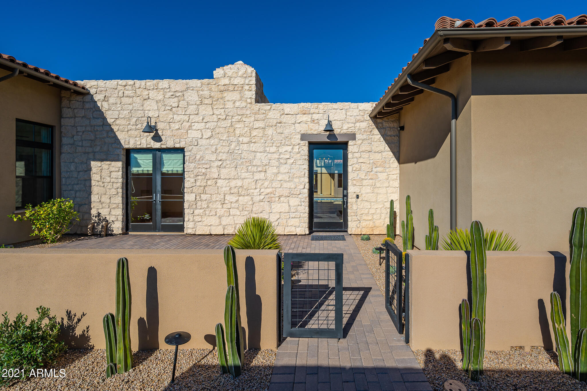 Built in 2019 and remodeled in 2021 on one of the best lots in Whitehorse * Dramatic McDowell Mountain and sunset views from the highest elevated lot in the community with 4 Bedrooms including a 2-room Guest House, Office/Exercise and 4-car garage * Recent updates include wood flooring, new custom light fixtures, new counter surfaces and hardware in kitchen, reimagined fireplace surround in great room, completely updated master suite and master bath with steam shower, Control 4 A/V and home automation and professional landscape overhaul * No interior steps * Enjoy seamless indoor/outdoor living with walls of glass that connect the great room and game room to both the interior courtyard living area and the grassy backyard * Like NEW without the wait!