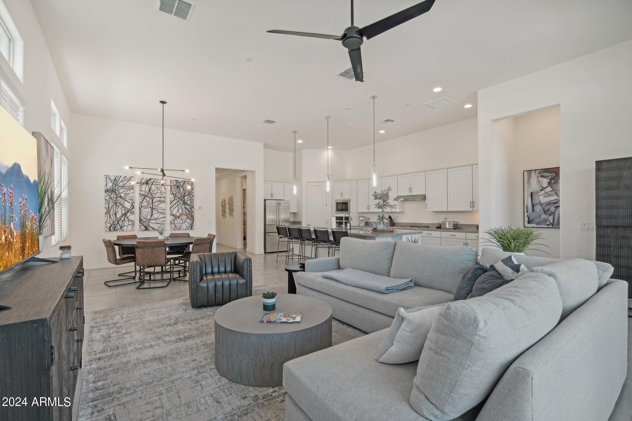 Discover resort-style living in the heart of Cave Creek in this beautifully appointed 3-bedroom, 3-bathroom home, just a short stroll from the town's charming shops, restaurants, and entertainment. Designed for both comfort and style, the open-concept floor plan features soaring ceilings, granite countertops, new appliances, and a blend of tile and carpet flooring. Relax on your private patio with a cozy fireplace, just steps from the community pool. Residents enjoy exceptional amenities, including a heated pool and spa, fitness center, pickleball court, BBQ pavilion, fire pit, and dog park. Move-in ready and perfectly located, this home offers the ideal blend of luxury, convenience, and the vibrant Cave Creek lifestyle.