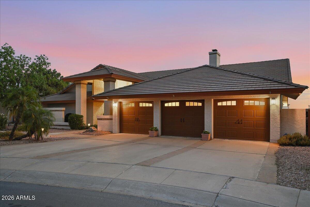 Do not miss out on this exceptional North Phoenix home with beautiful sunset views and nestled on a quiet cul-de-sac in the shadow of Lookout Mountain. Offering 4 bedrooms, 2 full baths, 2 half baths, and 3,399 square feet on an oversized 15,528-square-foot lot, this rare property combines space, privacy, and unforgettable west-facing sunset views and has been lovingly maintained by the same owner for 34 years. The backyard is designed for Arizona living with a sparkling pool, putting green, mature landscaping, and multiple outdoor living areas. Inside, the recently updated kitchen opens to spacious living areas highlighted by a double-sided wood-burning fireplace. Move-in ready with the opportunity to personalize over time, additional features include: a newer roof, three-car garage, NO HOA, and Paradise Valley schools. Located just moments from Lookout Mountain hiking, shopping, dining, and freeway access, this is a rare opportunity to own a beautifully cared-for home in one of North Phoenix's most established neighborhoods.