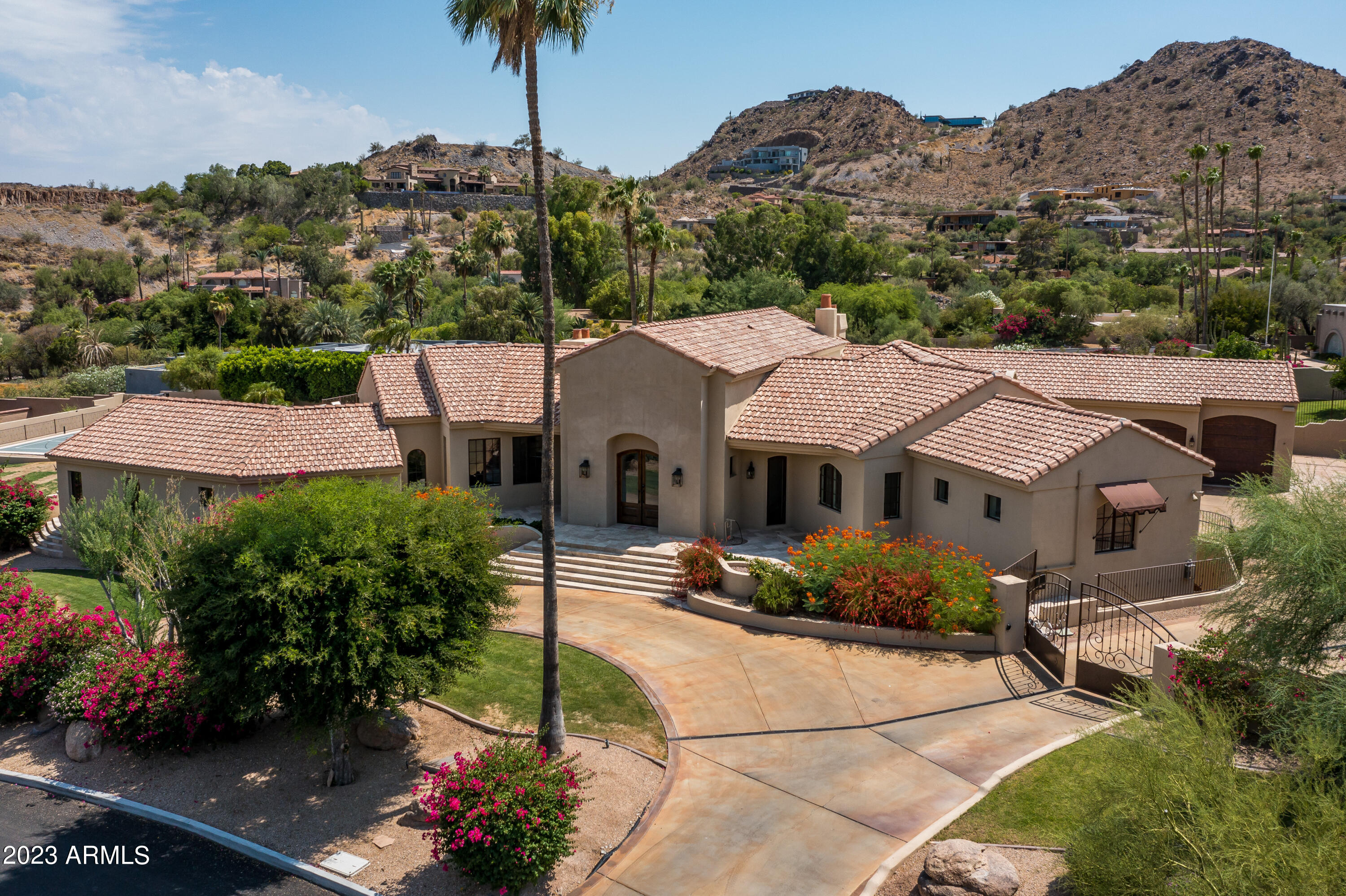 Santa Barbara meets Restoration Hardware in this exquisite block construction home on a premiere view lot. Elegance meets comfort in this stunning 5 bed, 7 bath luxury residence.  The home's open layout provides ample space for indoor/outdoor living & entertaining.  An 18 ft frameless folding glass wall in the family room, reveals breathtaking PV mountain views from your private oasis complete with salt water pool,(new 2022) spa, sports court,BBQ area  & new limestone, paver seating area -perfect for the sunrise & sunset views. Home's interior boasts a recent refresh with new door hardware and lighting fixtures updated in 2023, adding a contemporary touch to the overall design.  Cabinets newly painted 2023 , new Acs, epoxy garage, and more done within the last 18 months. While the property was completely renovated in 2018 , the sellers have also updated major mechanicals of the home as well as a long list of other features available on request.  All furniture available on a separate bill of sale. A truly turnkey property awaits the most discerning buyer !