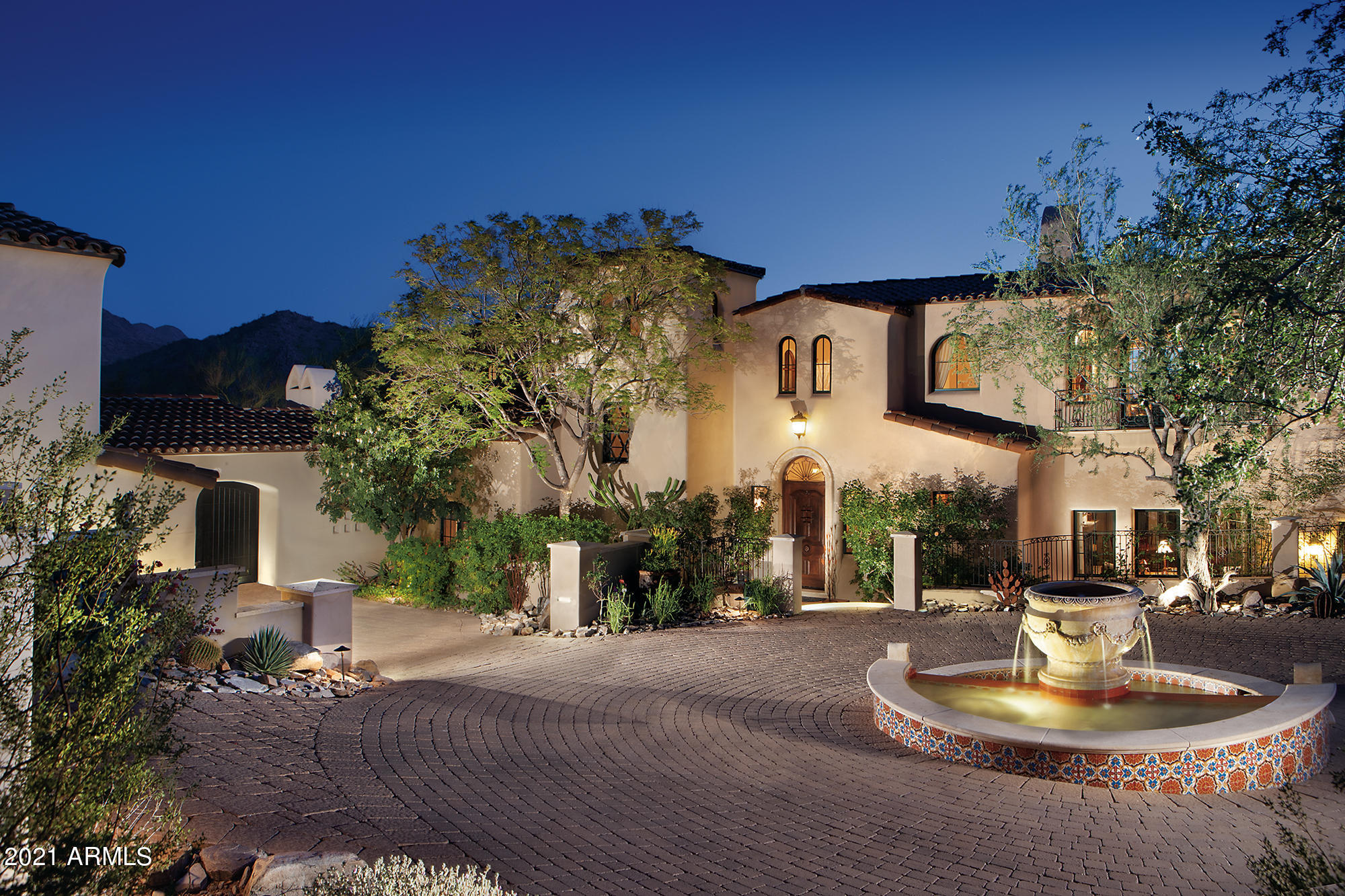 Cradled in the hillside of the McDowell Mountains rests this romantic Spanish colonial featuring stunning panoramic city light, mountain & golf course views. The home was designed by Erik Peterson and quality built by Salcito Custom Homes. The expansive Great Room incorporates formal dining and spacious sitting area showcasing a vaulted beamed ceiling, limestone fireplace and multiple French doors opening to the outdoor patios, pool & spa. Just adjacent is the multiple island kitchen and breakfast nook sure to be a favorite gathering spot. The owners' suite includes a lavish bath, two closets, wet bar & adjoining office - all opening to a spacious patio deck to take in the views. The west wing of the home sports a lavish guest retreat & 3 ensuite bedrooms including a 2nd Master Suite. When you add the bedroom in the separate casita it equals 5 bedroom ensuites. Other features include 2 offices, fitness room, 2 powder rooms, 5 fireplaces, multiple fountains, barbecue, covered patios, outdoor fireplace and fine finishes throughout. The home was built under the City of Scottsdale Green Building program. The Silverleaf community is guard gated & security patrolled. Full & social memberships are available at The Silverleaf Club featuring a Tom Weiskopf championship golf course, fitness center, spa and fine or casual dining. Memberships are also available at nearby DC Ranch Country Club and The Village Health & Racquet Club. DC Ranch Market Street is nearby with boutique shopping, grocery & restaurants.
