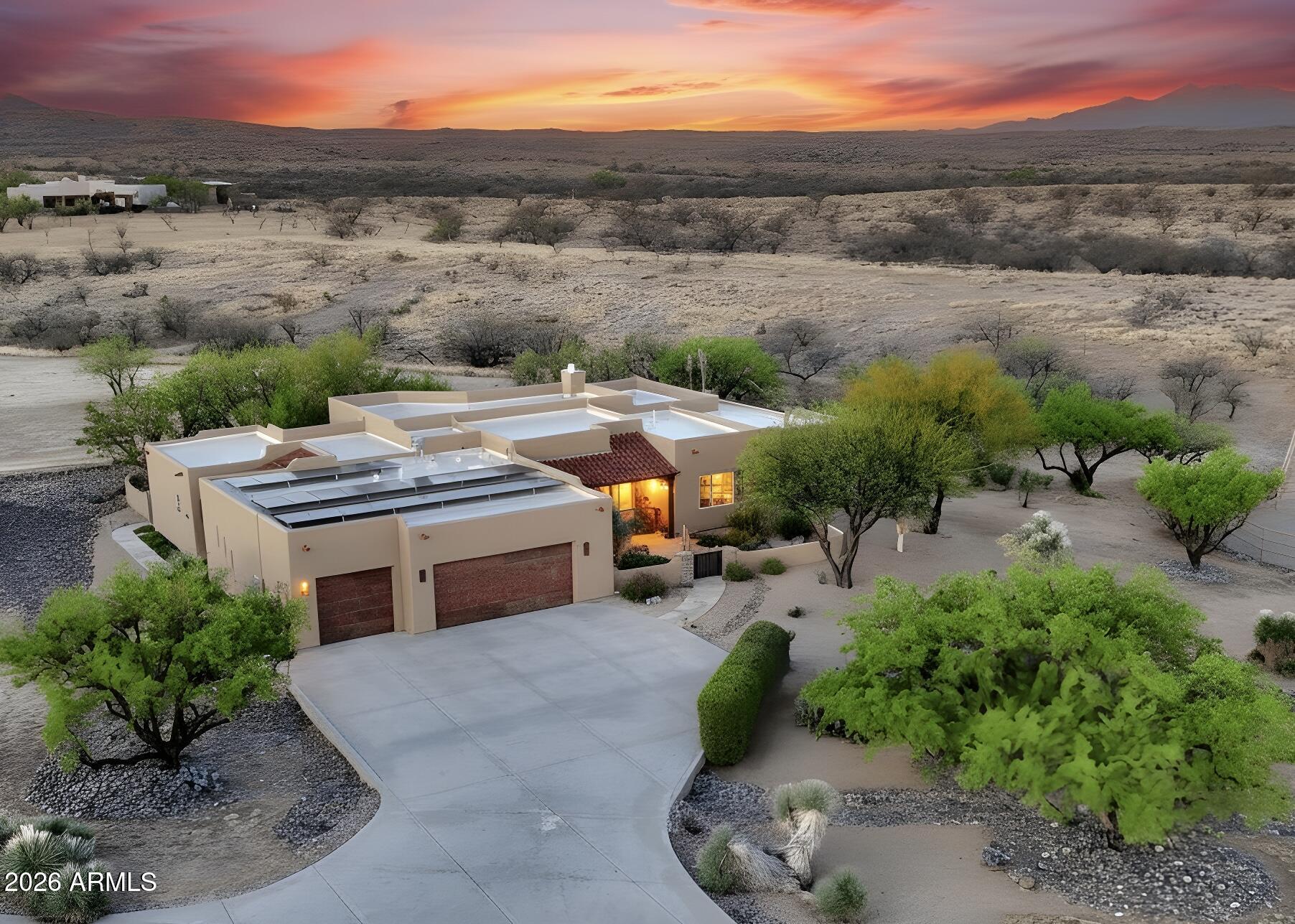 Back on the market at no fault of the home or the sellers!

Your Dream Home in Red Hawk at JSix Ranch Awaits! Nestled at the end of a quiet cul-de-sac, this custom-built Southwest Contemporary retreat offers elegance, comfort, and exceptional space for both everyday living and entertaining.

Inside, you'll find 3 bedrooms, 3 1/4 bathrooms, plus a private guest casita (1 bed/1 bath)--perfect for visiting family or friends. High-end finishes shine throughout, including travertine flooring, granite countertops, alder cabinetry, and premium KitchenAid stainless steel appliances.

The oversized primary suite is a true retreat, featuring a cozy sitting area, direct patio access, a spacious walk-in closet, and a spa-like bath complete with a luxurious walk-in shower and deep jetted tub. Expansive rear-facing windows fill the home with natural light while framing serene desert views.

Practical features include a three-car oversized garage--large enough for a full-size truck--and owned solar panels that significantly reduce energy costs.

Step outside to enjoy covered patios in both the front and back, ideal for soaking in stunning sunrises, sunsets, and the daily visits from local wildlife.

For equestrian enthusiasts, the property is fully equipped with a thoughtfully designed barn featuring two stalls with automatic waterers, a wash rack, storage space, and a temperature-controlled tack room with hot water. Additional amenities include paddocks, a round pen, a large turnout area, and a pipe-fenced arena--everything needed for your horses.

Both the interior and exterior have been freshly painted within the past two years, making this home truly move-in ready.