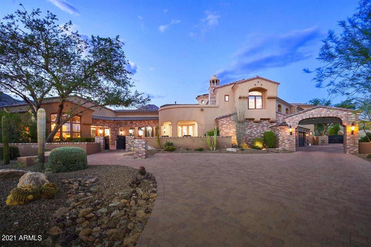Elegant custom hacienda set on a private 1.8 acre view lot in gated Rancho Trinidad. The main home is approx 7900 sf and the separate guest home complete with full kitchen is approx 828 SF. Custom in every regard with the highest quality finishes. Master retreat is luxurious and includes a private sitting area, second office area, and views~Master bath rivals any 5 star resort and offers two separate connected  baths with expansive closets, steam shower, traditional shower, outdoor spa and so much more. Ideal home for entertaining with impressive dining room, wine cellar, butler pantry. Several special areas ideal for your work from home needs. Outdoor resort with stunning pool, gazebo, fireplace, many relaxation areas for escape and taking in the gorgeous views. The yard is SPECTACULAR! Many upgrades and improvements have been completed over the past few years. Ideal location near The McDowell Mountain Preserve offering miles of hiking and biking trails, fine dining, Mayo Clinic, excelling Scottsdale Schools and the nationally acclaimed Basis Charter schools .The list goes on and on of the custom features in this stunning property. You must see it to believe it!