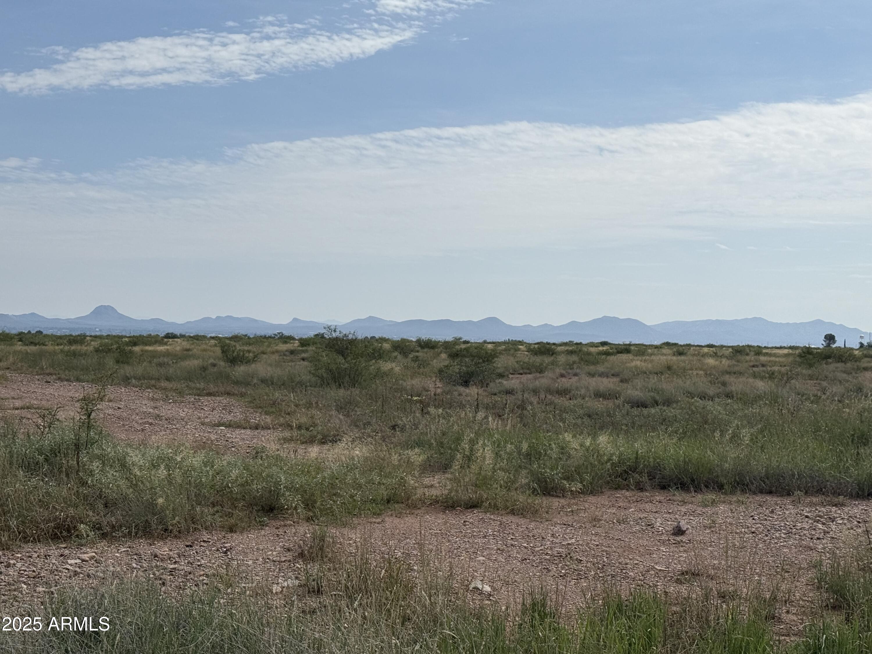 Great opportunity to own 1.39 acres in Cochise County, conveniently located between Bisbee and Douglas with easy access to Highway 80. This parcel is zoned SR-12 (Single-Household Residential, minimum 12,000 sq. ft. lots), offering flexibility for residential use. Power and cable are available at the lot line (buyer to verify connection). Water and septic will be needed. Enjoy wide-open desert views, peaceful surroundings, and a location that provides quick access to town amenities while still feeling rural and private.