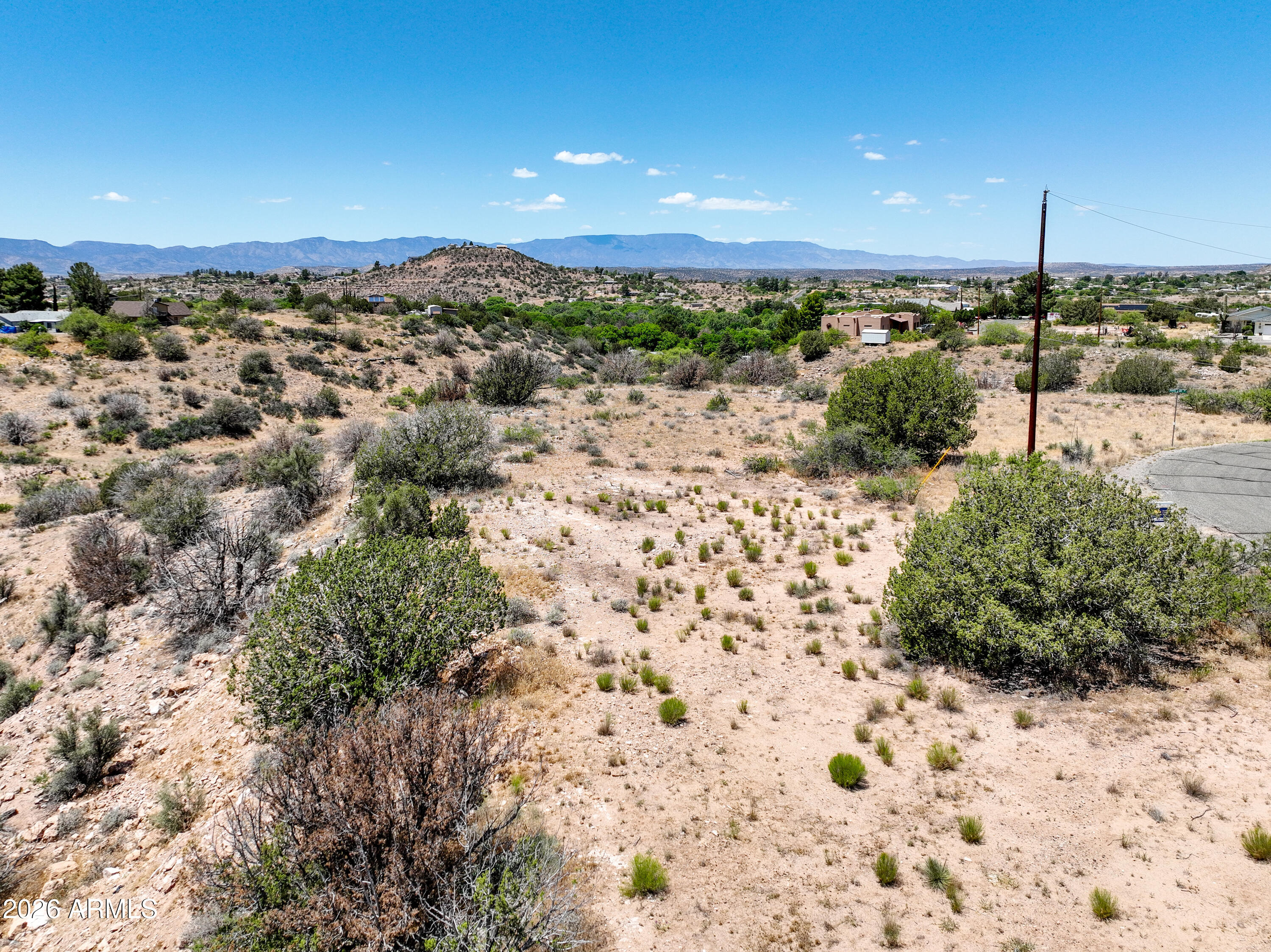 Build your custom retreat on this 1/3 acre lot in Rimrock, located just 25 minutes from the Village of Oak Creek and 30 minutes from Sedona. This property is situated in a No-HOA environment within a neighborhood dedicated to site-built homes only. Infrastructure includes direct paved road access and power available across the street. The topography offers an efficient building site at the front of the lot with a gulch on the back half. This area is in close proximity to the Verde Valley and the Northern Arizona trail systems. This parcel provides the utility and space required for a refined Arizona lifestyle in a rural setting.