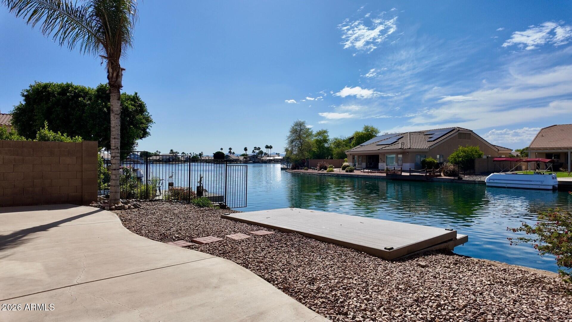 Very clean home with tile flooring, high ceilings, 2bedroom with office, walk in closet, new stone countertops, open floorplan with waterfront views, huge patio area with private boat dock, 2 car garage, all electric, all appliances included, great location & good access to Thunderbird & 101 freeway.