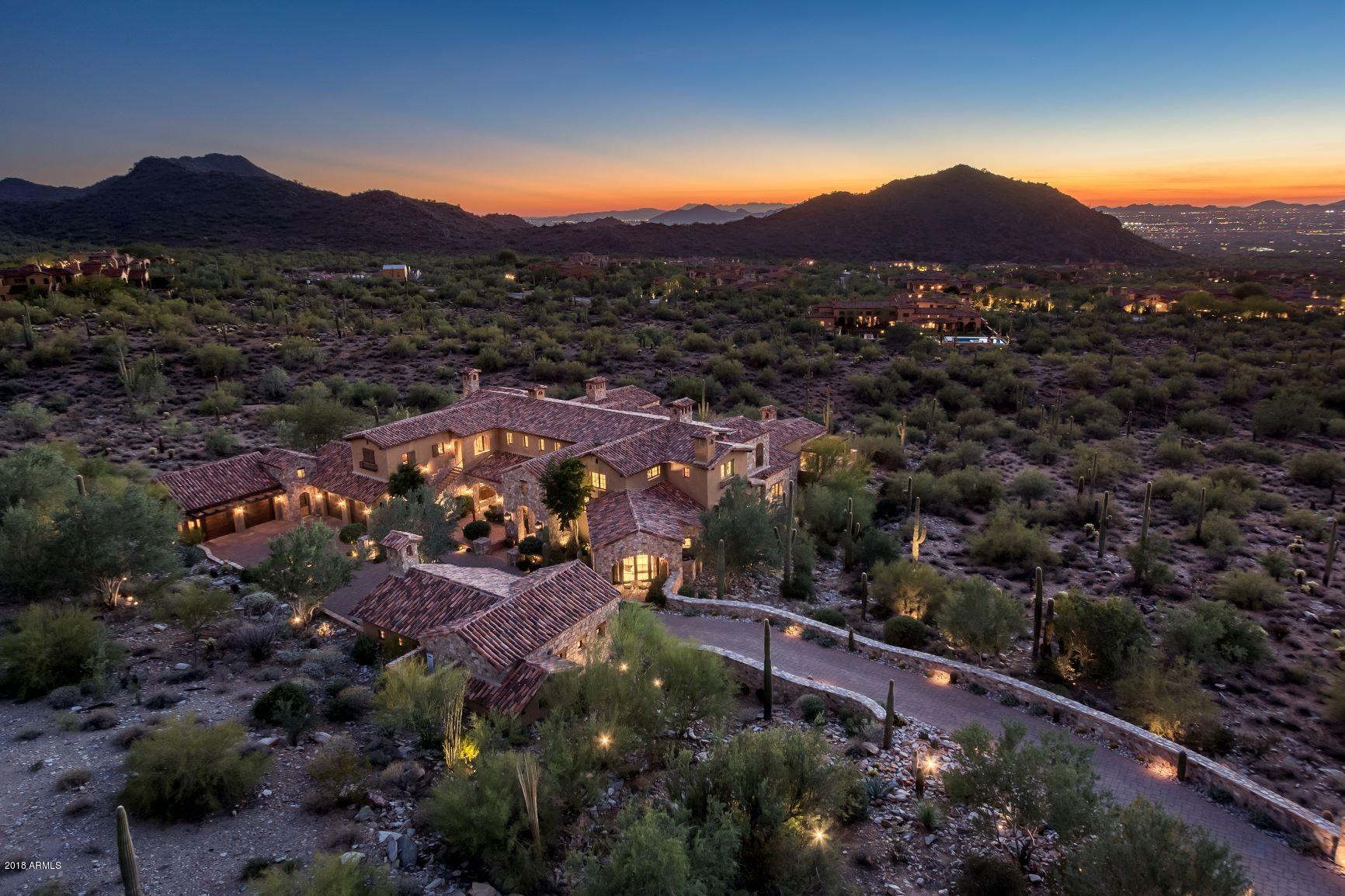 This meticulous Mediterranean estate located in the Upper Canyon of the exclusive Silverleaf community offers unparalleled city light views and breathtaking sunsets. A distinctive collaboration between PHX Architecture and Calvis Wyant Custom Homes, with an unrivaled sophistication of finishes and attention to detail this home remains true to its timeless architecture. Highlights of this gorgeous estate are: a grand living room with vaulted beam ceilings, gourmet kitchen, a spacious family room with stone fireplace, bar and wine cellar, master retreat with cozy sitting room; His and Hers along with theater room and second staircase are just part of the impressive spaces of this home. The large casita includes living room, kitchenette and  bedroom. Schedule a private tour today!