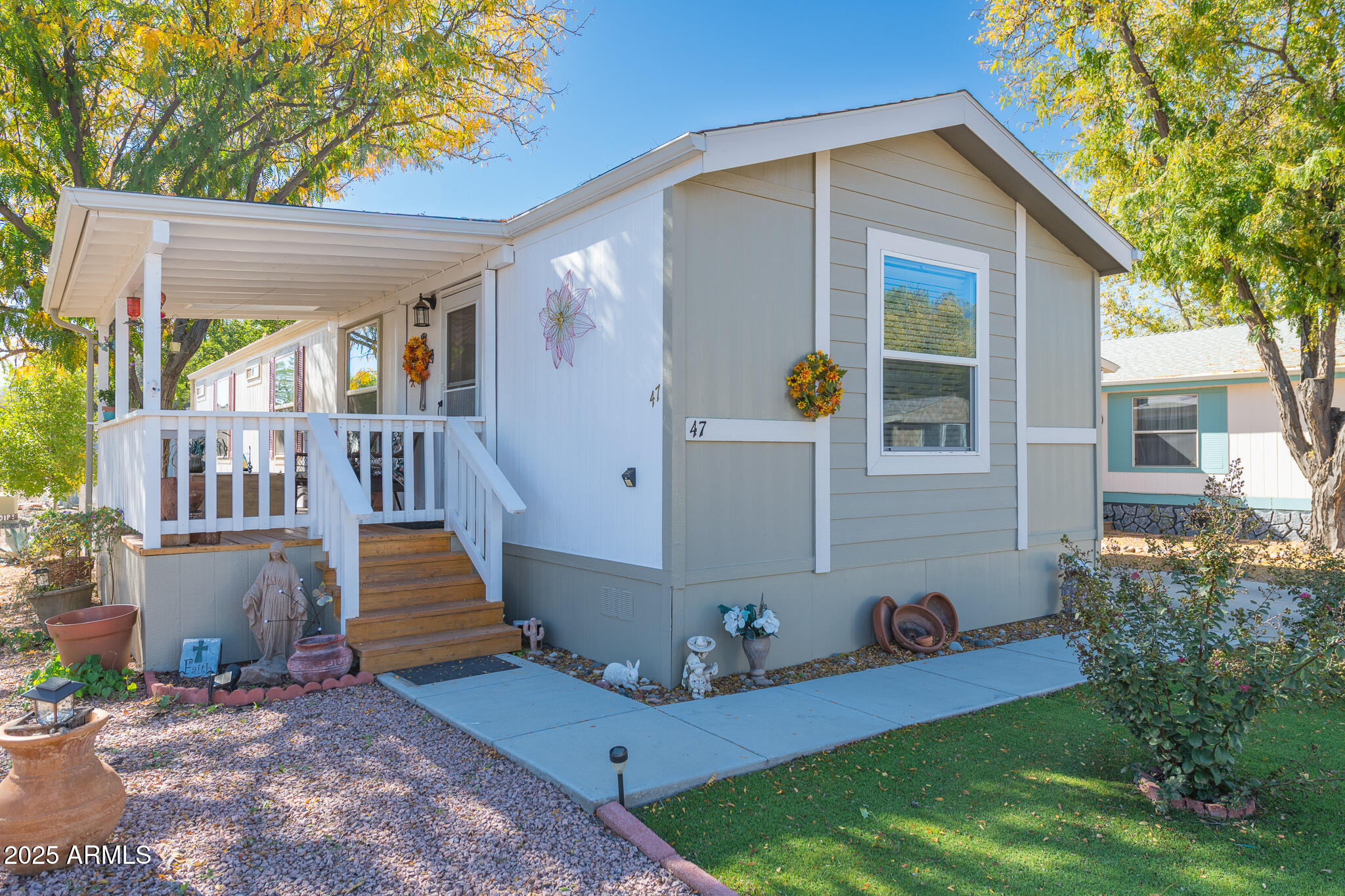 This beautiful 2-bedroom, 2-bath 2019 CAVCO home is located in a quiet 55+ community. The open floor plan features vaulted ceilings, luxury vinyl plank flooring, and plenty of natural light. The kitchen includes a farmhouse sink, and a reverse osmosis system. Outside, you'll find a fenced yard great for pets or gardening, a covered porch with a skylight, and an enclosed carport with a added swing door to create a private patio or extra storage leading to the workshop. You will love corner lot and the mature trees which provide great shade. The Willows at Camp Verde community offers peaceful living. You will find a community club house, pickleball court and picnic areas & horseshoes area and more to entertain guests. This home is truly move-in ready and beautifully maintained!