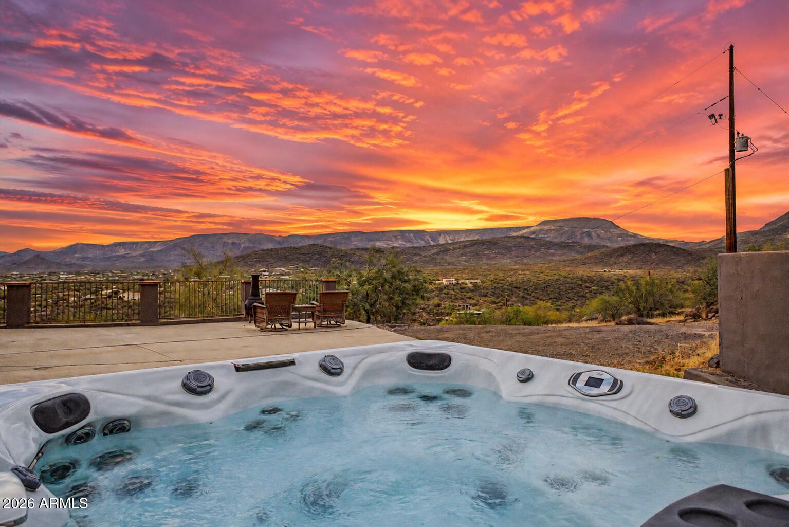 Mountainside Home! | PAID-OFF SOLAR, PANORAMIC CIRCLE MOUNTAIN VIEWS, POOL, 3-CAR GARAGE | This custom-built hilltop home was designed to maximize every inch of the panoramic Circle Mountain views that make it so special. Large dual-pane Low-E windows bring in natural light and scenic views across nearly every room while helping keep the energy bill down. The single-level layout offers flexible living spaces, a granite kitchen with island seating, and an owner's suite with bay window, walk-in closet, and soaking tub. A second main bedroom with its own bath adds flexibility. Out back, the covered patio, pool, and wide desert setting capture some of the best views in New River. Paid-off solar adds value, and a utility easement provides free internet while also paying the homeowner.