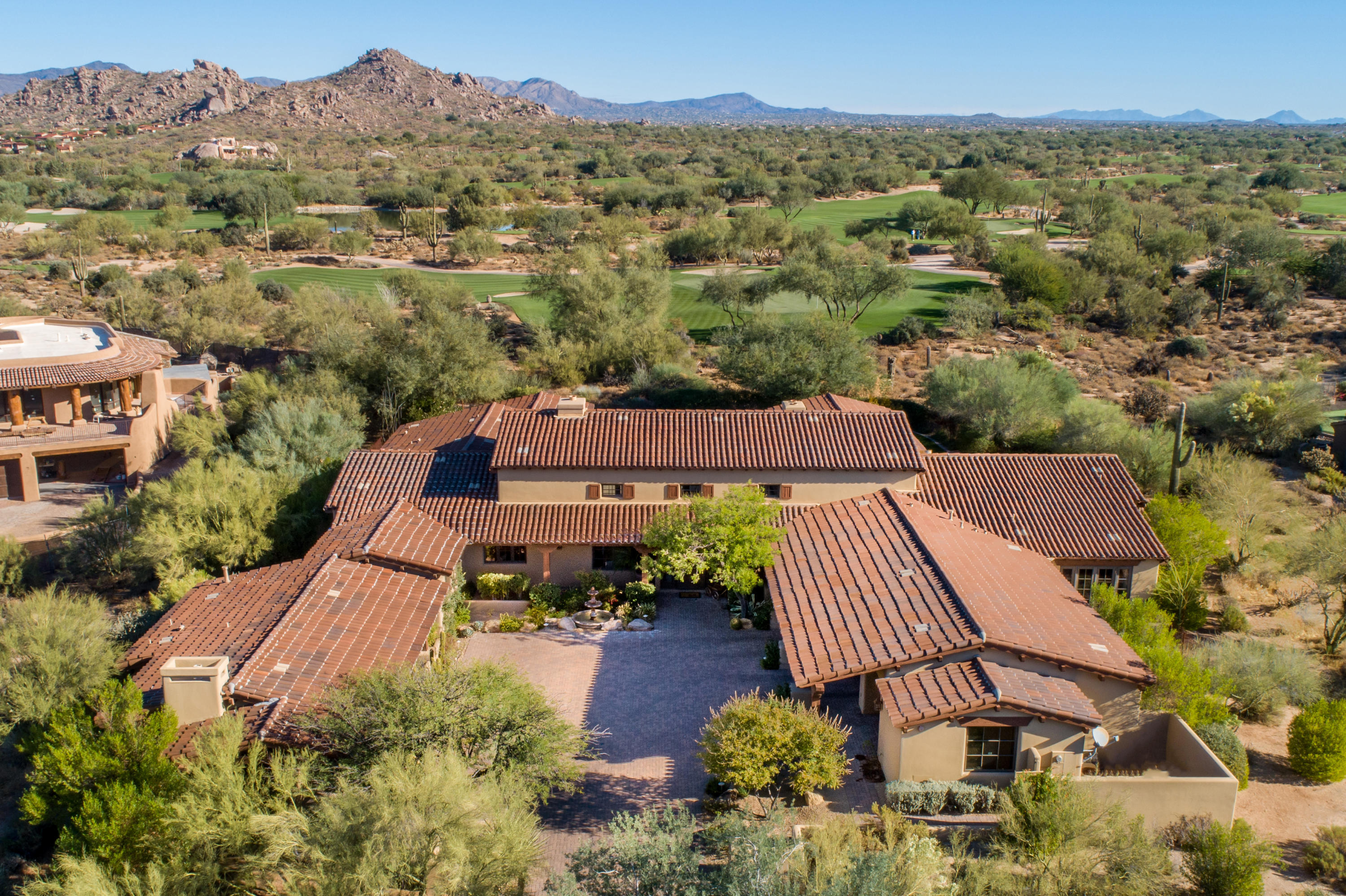A stunning Bing Hu designed home built by Platinum Companies on the 7th Green of the Lower Course in Whisper Rock Estates. The open and bright floor plan offers a media/game room, large office, soaring ceilings, four interior fireplaces and a guest casita. A generously appointed kitchen opens to a warm and inviting family room. The estate size lot affords ultimate privacy with mountain & golf course views. The outdoor living areas offer spacious patios, beautiful gardens, your very own green belt, outdoor fireplace and a heated pool & spa. Upgrades include the addition of a 371 sq ft office, expanded backyard & outdoor spaces and expanded master walk in closets. Whisper Rock community amenities include tennis & pickle ball courts, fitness facility with locker rooms and a large park setting