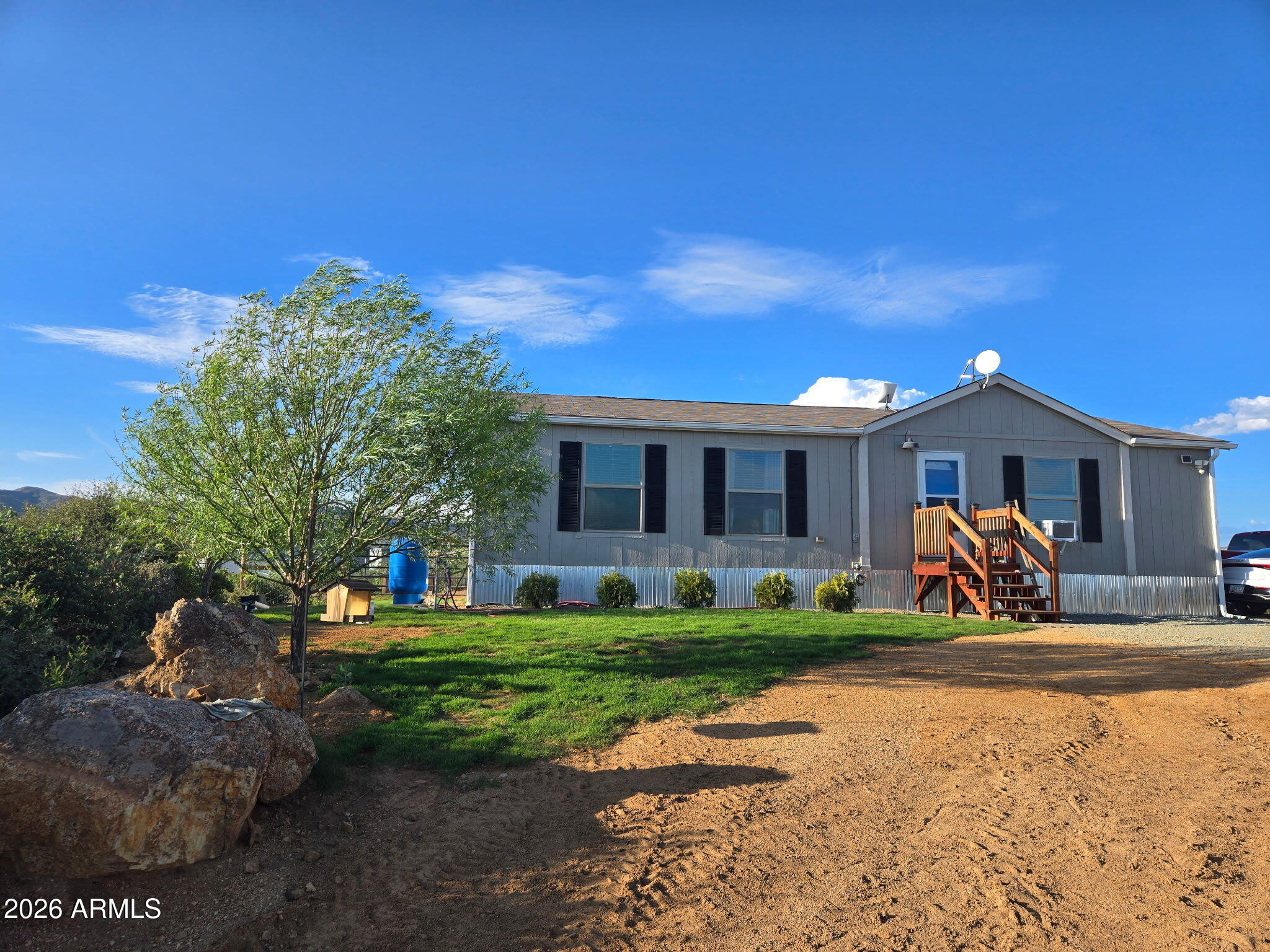 Escape to Northern Arizona and enjoy cooler temperatures on 3.37 usable acres at the end of a quiet dead-end street. This unique property features two 2023 manufactured homes ideal for multigenerational living, rental income or guest accommodations. The main home offers 3 bedrooms and 2 baths, while the second home includes 2 bedrooms and 1 bath. Both feature luxury vinyl flooring, dual-pane windows, faux wood blinds and included appliances. The property also offers a private well, full drip irrigation system, established fruit trees, roses, junipers and a 10x20 shed with roll-up door. Bring your horses, RVs, and toys with no HOA! Own two homes Up North for the price of one! Conveniently located between Phoenix and Prescott for ease of convenience!