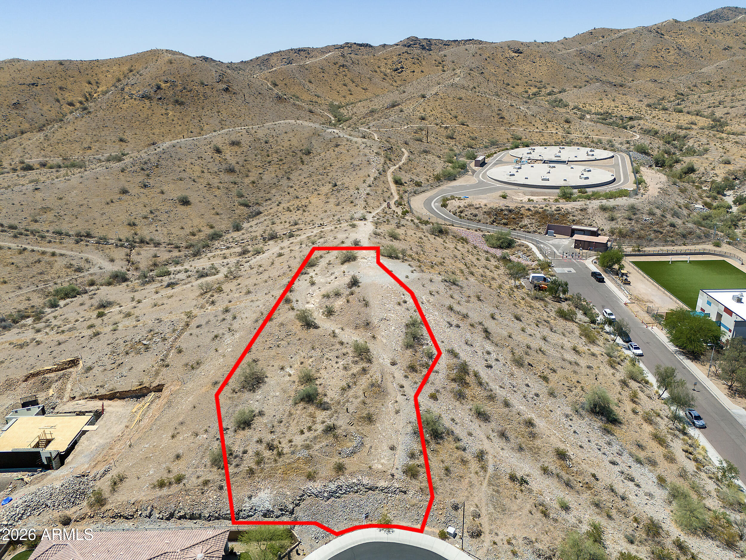 Rare opportunity to own the highest lot nestled within this gated luxury community of Legacy Mountain Villas. This cul-de-sac homesite offers the chance to create a custom retreat surrounded by the beauty of South Mountain with panoramic views. Enjoy private neighborhood access to scenic walking trails while staying just minutes from Raven Golf Club, Diablo Stadium, ASU, Downtown Phoenix, and Sky Harbor Airport.  A perfect setting for buyers seeking privacy, outdoor living, and convenience in this highly desirable mountain community.