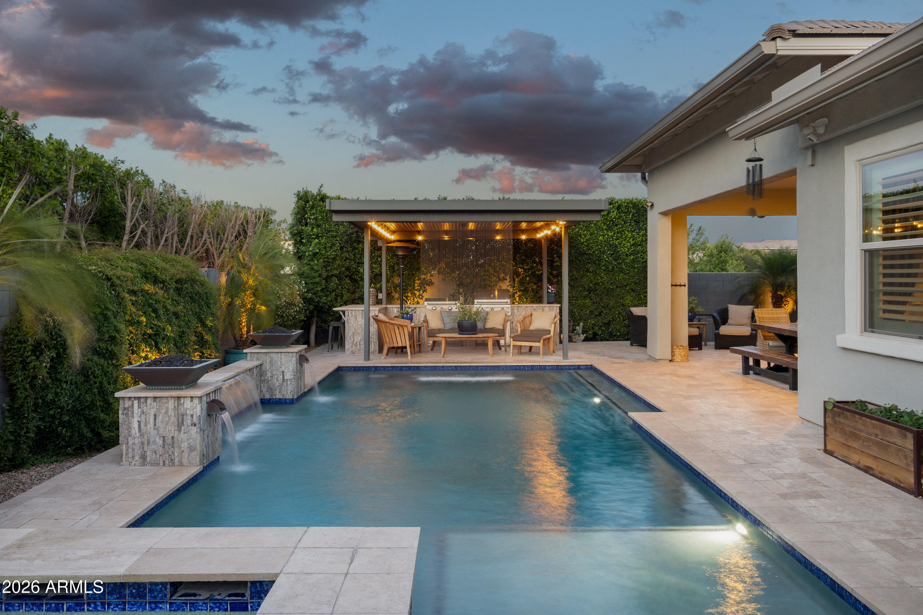 Welcome to this exceptional single-level home in the highly sought-after Lakeview Trails neighborhood of Morrison Ranch. Built in 2019 and situated on an oversized north/south-facing corner lot with no neighbor to the east, this upgraded residence offers 4 bedrooms, 3 bathrooms, a private office, game room, and soaring ceilings throughout. The gourmet kitchen features quartz countertops, an oversized island, upgraded cabinetry, double wall ovens, a gas cooktop, built-in refrigerator, and walk-in pantry. The spacious primary suite includes dual walk-in closets, a soaking tub, and oversized shower. Large sliding doors open to a resort-style backyard with an extended patio, pergola, saltwater pool, spa, lush landscaping, dog run, and double side gate. Just steps from parks, greenbelts ,sports courts, and all that Morrison Ranch has to offer.