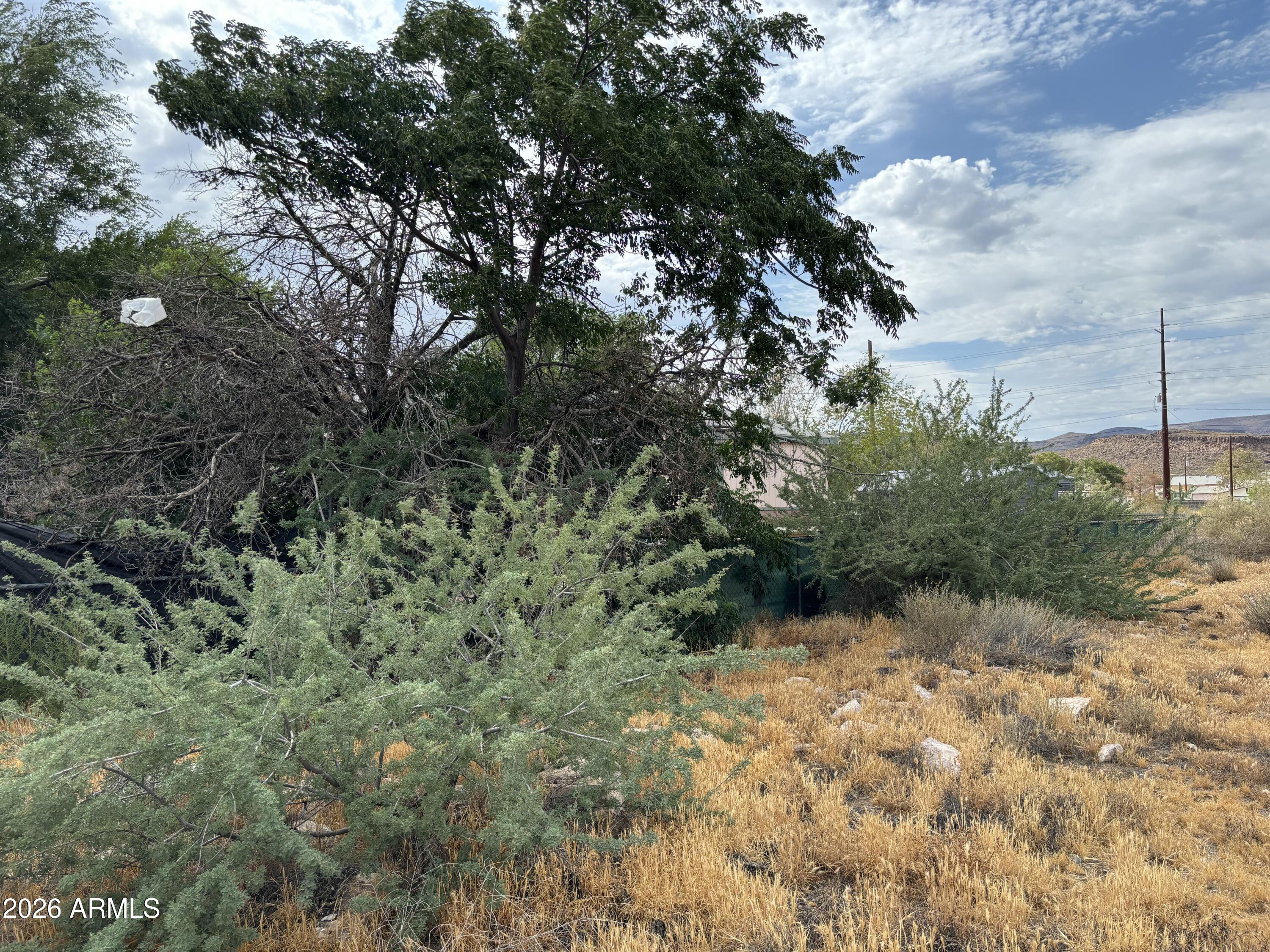This lot is being offered alongside its neighbor parcel.  Two lots for sale in Kingman!!  Northwest AZ poised for growth, expansion, and appreciation.  Improvements to road, infrastructure, and location make Kingman very very exciting.  This seller is willing to negotiate favorable terms to buyer.   What do you need, lets talk.   End of the road lots with stunning mountain views. Easy access, and location.  New frame homes being built very close.  Take advantage of this nice window of opportunity.  Reach out Today with your questions!!
