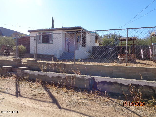 This is a great investment opportunity in a great area. Close to schools, shopping and more. There is a fenced front and back yard with RV gate and a detached workshop. The home features 1 large bedroom and a large living room. There is an eat in kitchen and a large laundry room. This property will not last