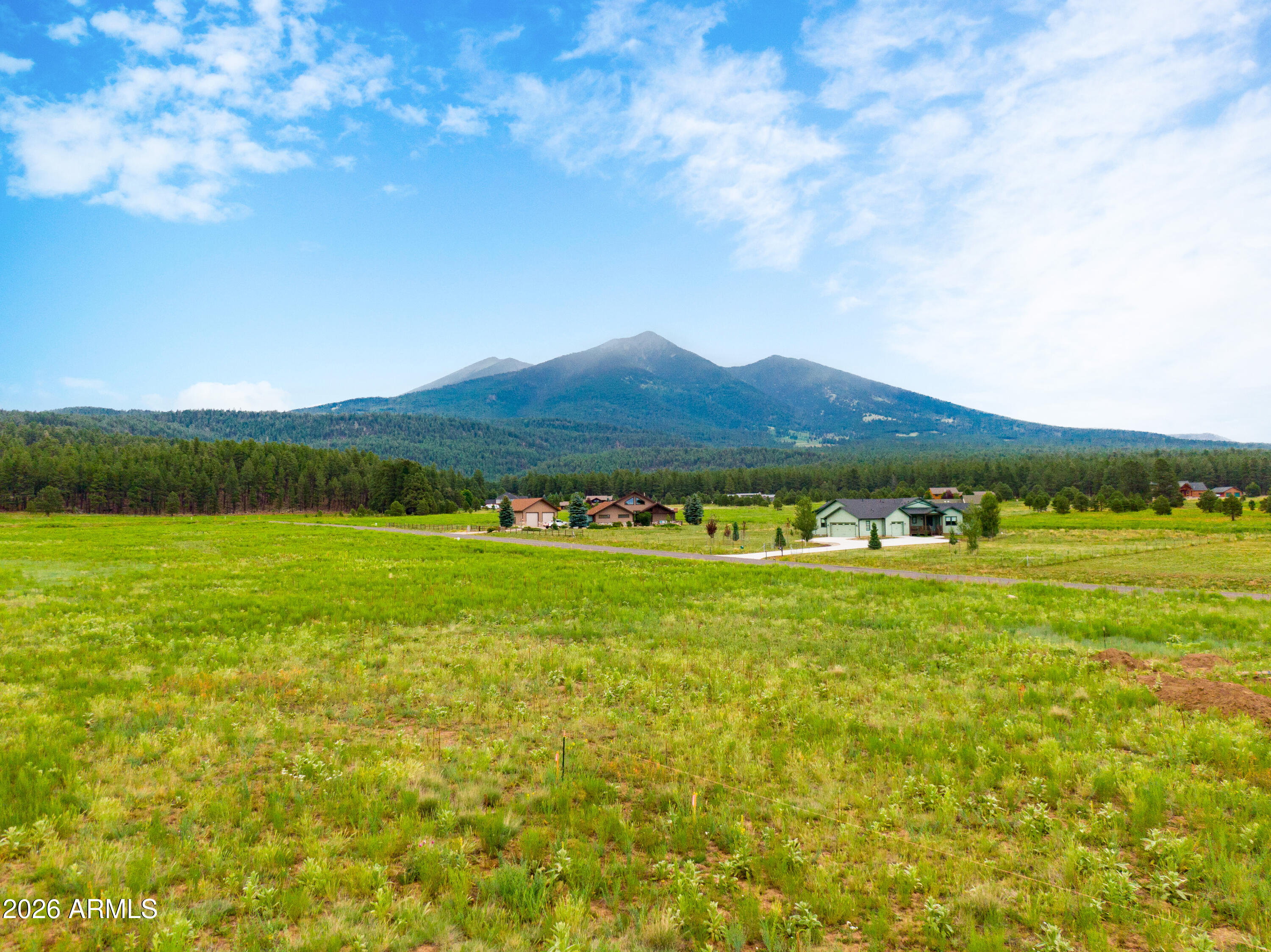 Just north of Flagstaff is this gorgeous property.  If you are looking for that perfect building lot with a spectacular view, this is it.  Imagine your custom home on this sprawling 2+ acre lot with the BEST views of the San Francisco Peaks.  Close to skiing, hiking, mountain biking...you name it.  National Forest access is a few minutes walk away.  This location is minutes from Flagstaff, an hour from the Grand Canyon, has underground electricity, natural gas and even a private water company.  Rural life can't get better than the quiet lifestyle this lot offers.